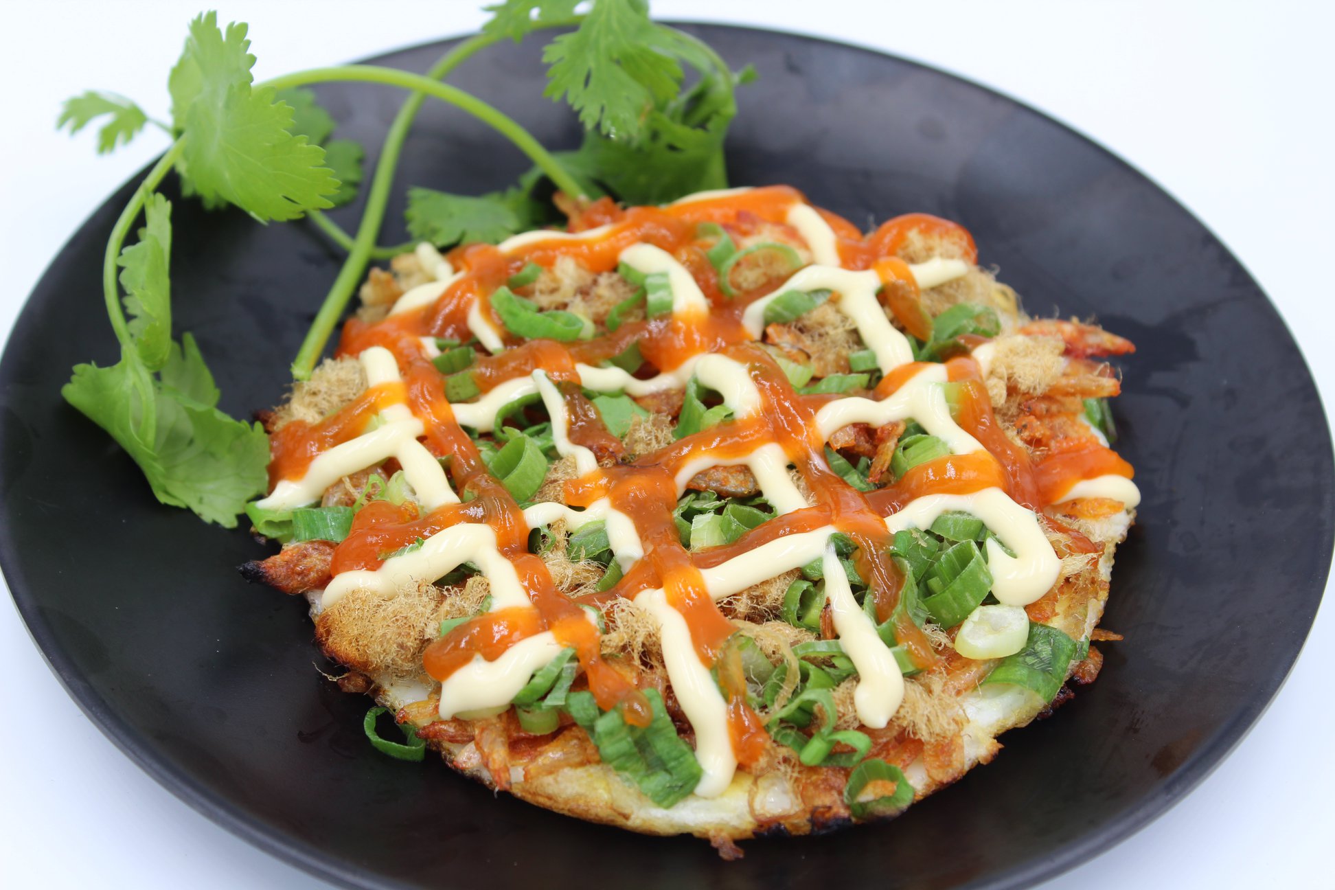 Order  A20:  Quail eggs pancake, topped with pork floss, scallions, dried baby shrimp, and drizz food online from Watda Pho store, Englewood on bringmethat.com