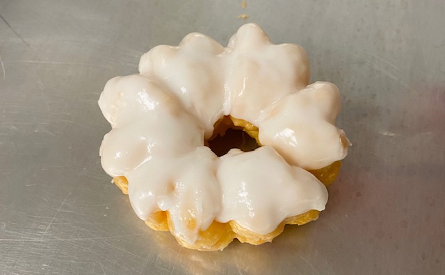 Order White French Cruller food online from Highland Donuts store, Bakersfield on bringmethat.com
