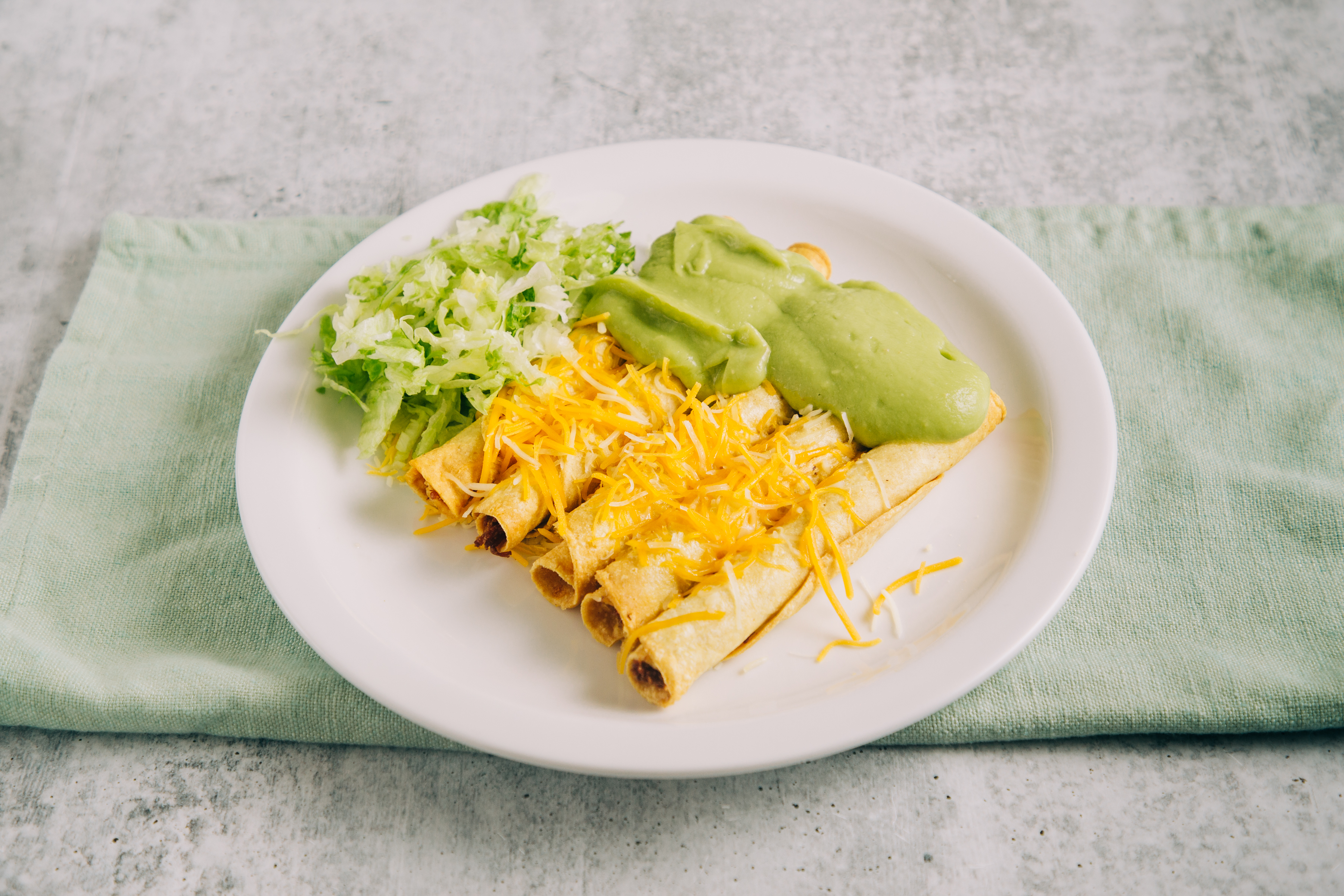 Order 5 Rolled Tacos with cheese and guacamole food online from Betos Mexican Food store, West Valley City on bringmethat.com