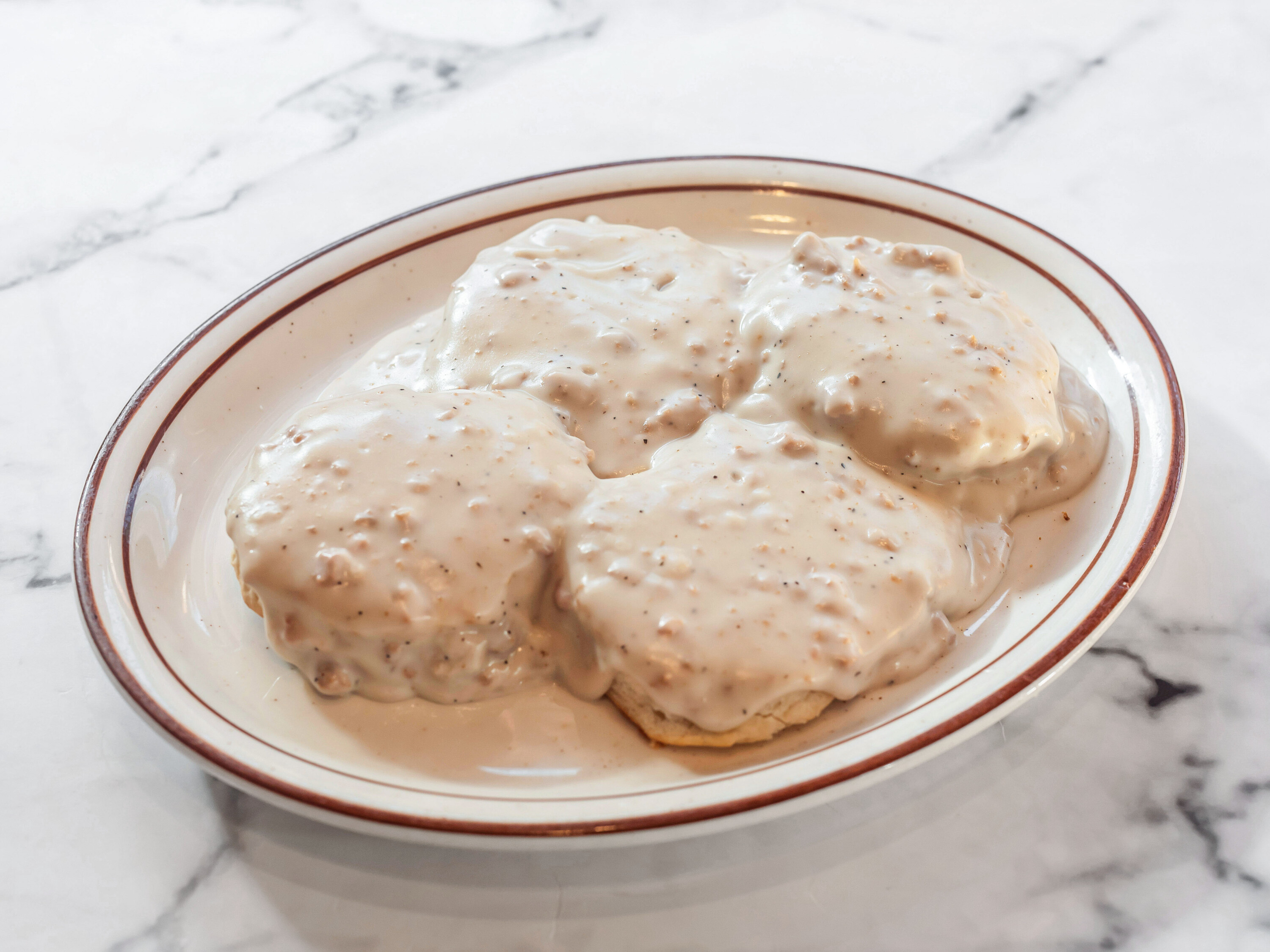Order Biscuits and Sausage Gravy food online from Duke Diner store, Eighty Four on bringmethat.com