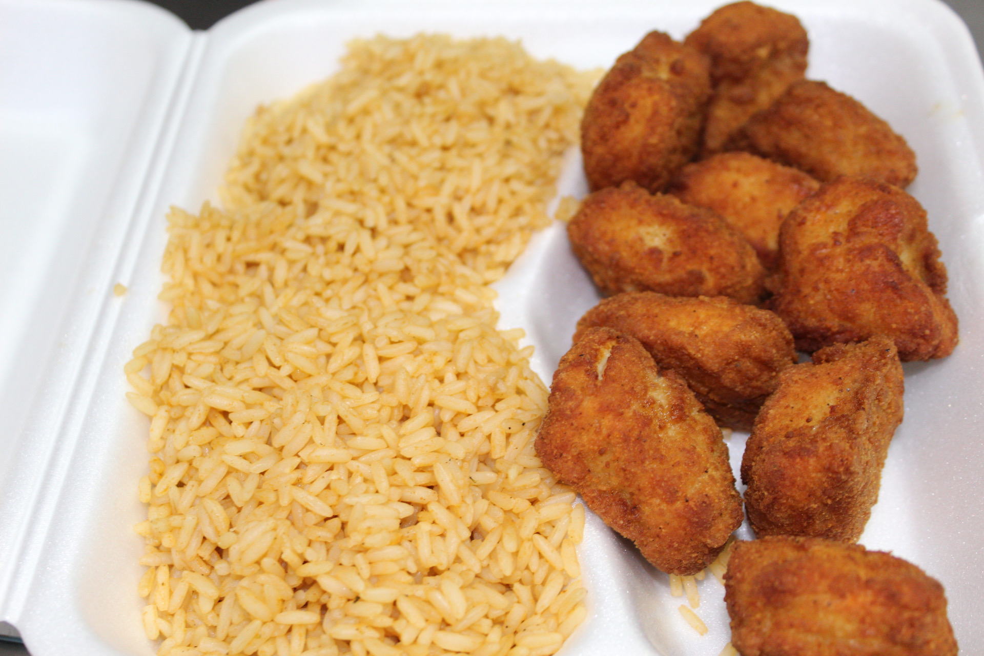 Order A8. Chicken Nuggets with Mexican Rice food online from Yummy Taco store, Inwood on bringmethat.com