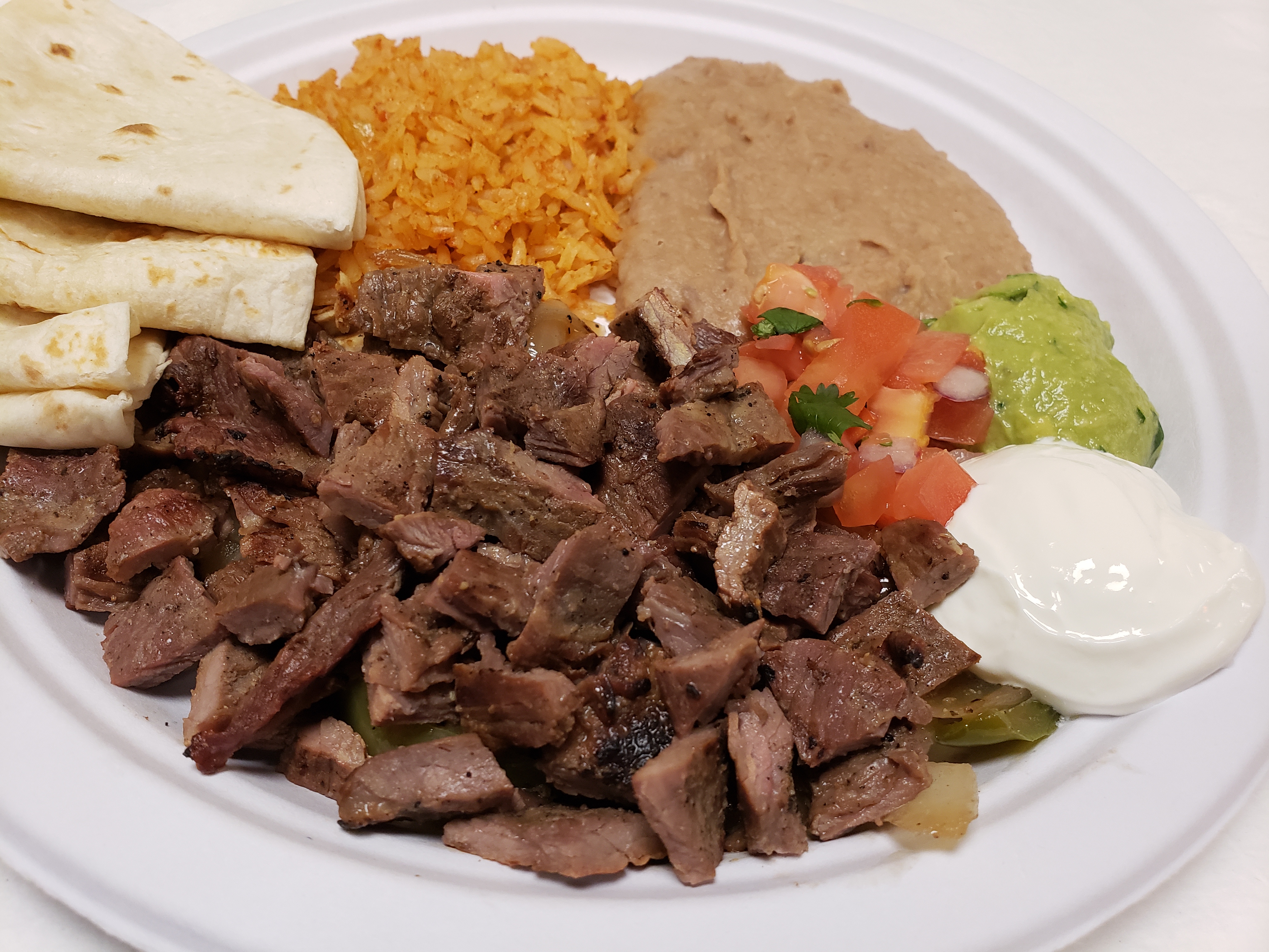 Order Fajitas Plate food online from Poblanos Mexican Cafe store, Dallas on bringmethat.com