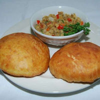 Order 1 Bakes(fry dumpling)& Salt Fish food online from Taste of the Caribbean store, Capitol Heights on bringmethat.com
