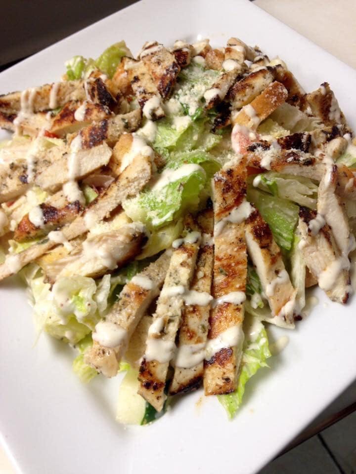 Order Caesar Salad with Grilled Chicken - Salad food online from Linda's Pizza store, Ocean Gate on bringmethat.com