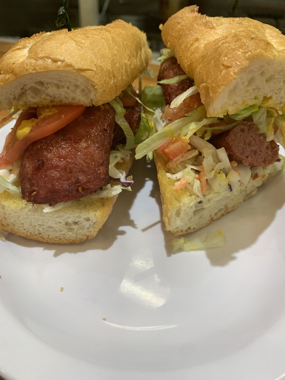 Order Spicy Cajun Sausage Po-Boy food online from The Lost Cajun store, Humble on bringmethat.com