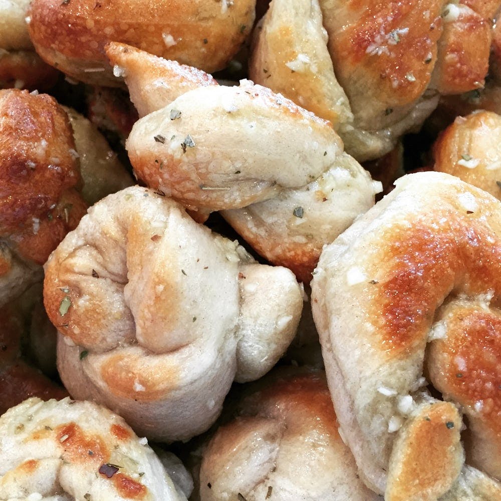 Order Garlic Knots - 6 Pieces food online from Zappia Cucina & Brick Oven Pizza store, Summit on bringmethat.com