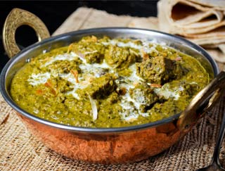 Order Saag Gosht food online from Gourmet India store, Houston on bringmethat.com
