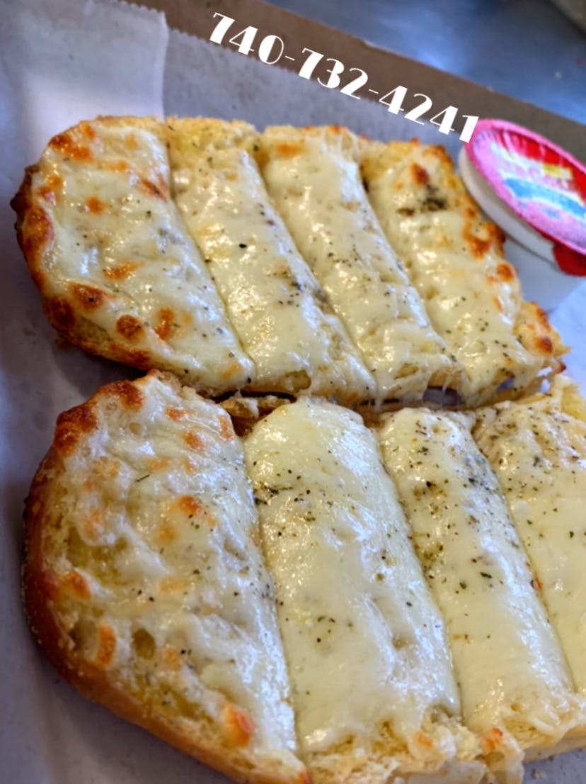 Order Cheesy Bread - Half food online from Wally Pizza & Subs store, Caldwell on bringmethat.com