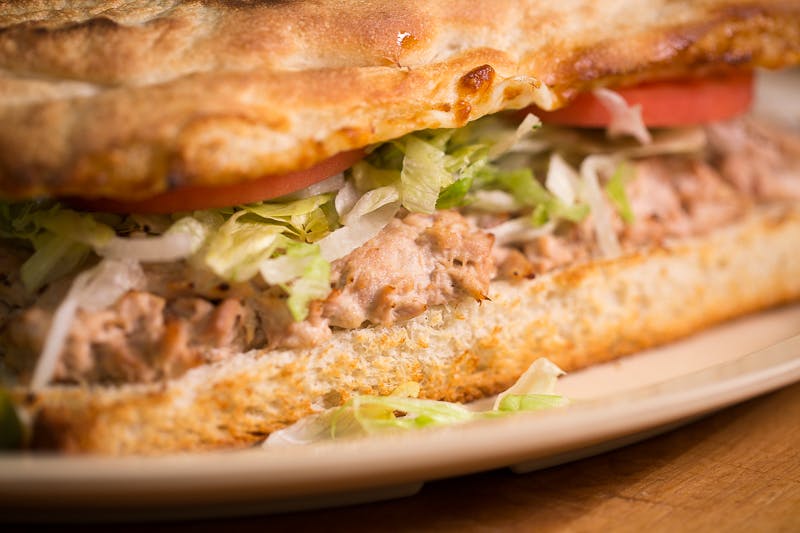 Order Tuna Grinder - 8" food online from Mancino Grinders & Pizza store, New Haven on bringmethat.com