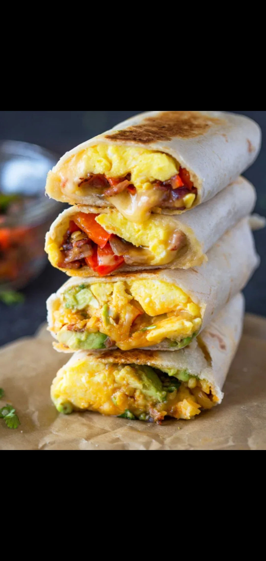 Order Cheesy Avocado Wrap (eggs pepper  jack  & Vermont cheddar mushrooms peppers & Avocado) food online from American Gourmet Foods Deli store, New York on bringmethat.com