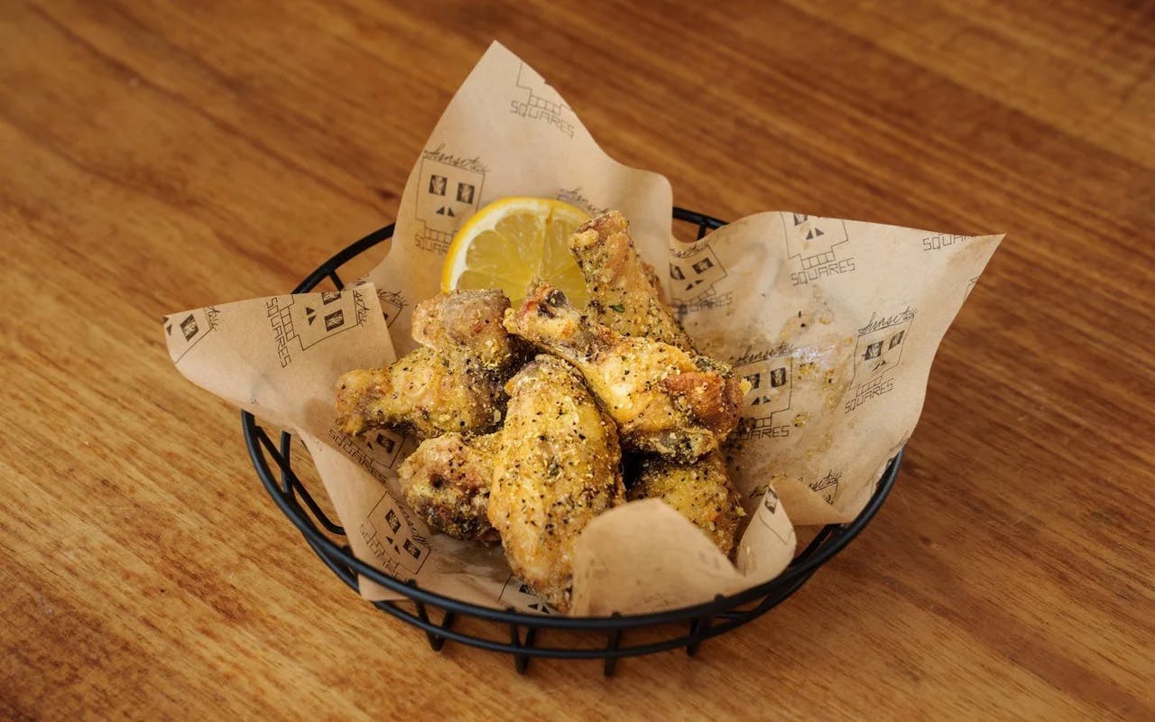 Order Lemon Pepper Wings - 6 Pieces food online from Sunset Squares Slice Shop store, San Francisco on bringmethat.com