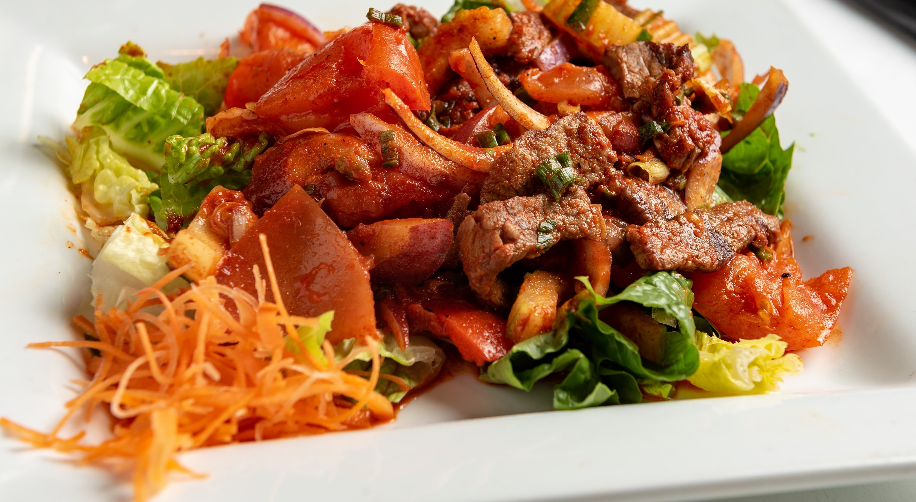 Order Fiery Grilled Beef Salad food online from Phuket Thai Restaurant store, Huntsville on bringmethat.com