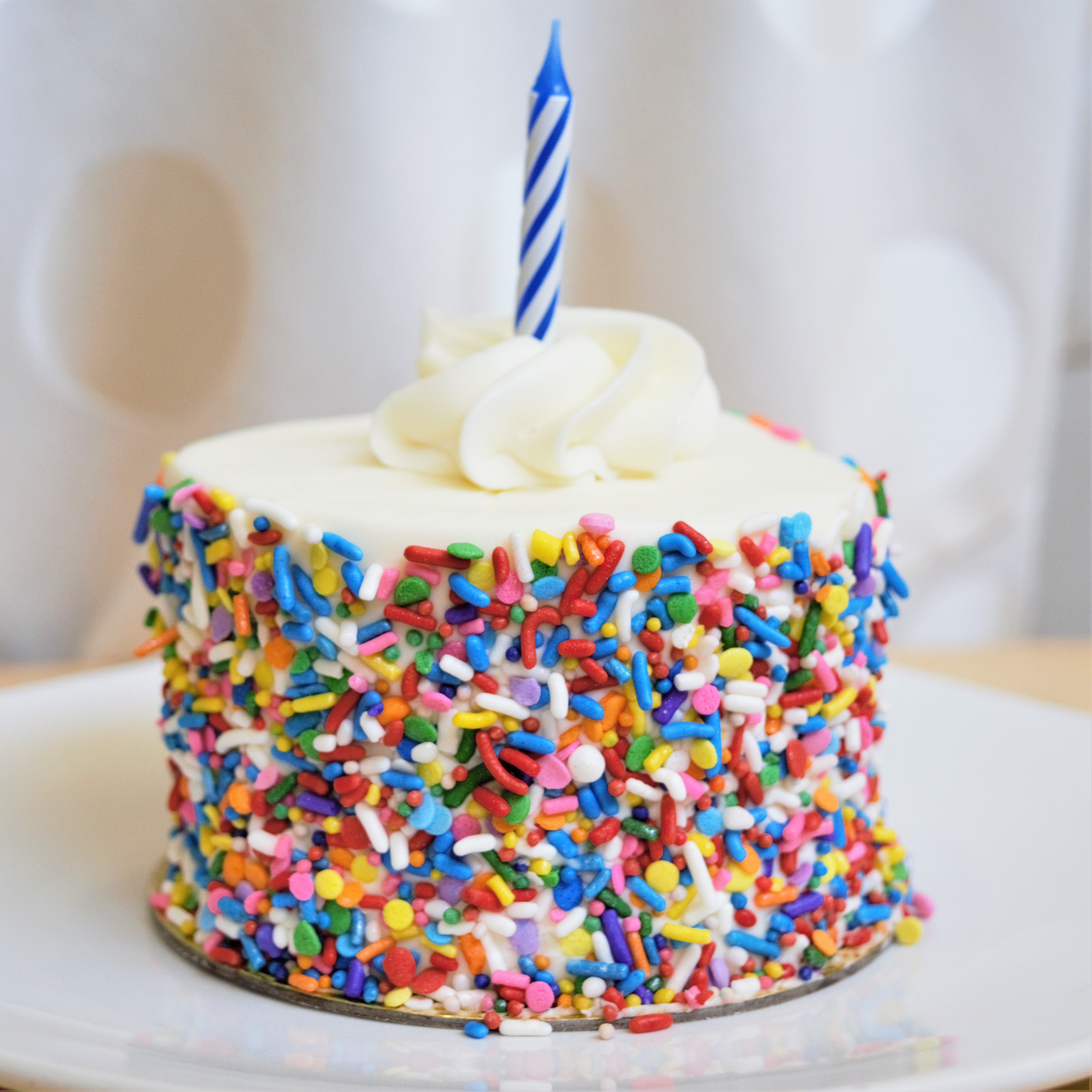 Order Rainbow Sprinkle Birthday Cake food online from Honeymoon Sweets store, Tempe on bringmethat.com