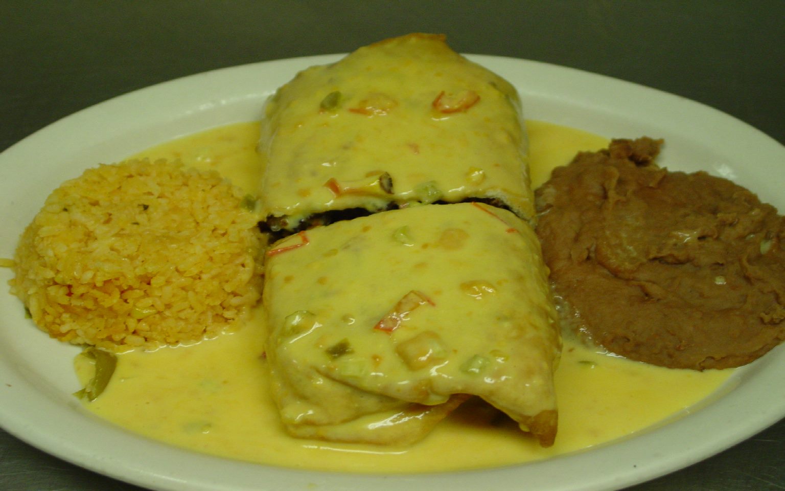 Order 34. Chimichanga food online from Perico's Mexican Cafe & Bar store, Houston on bringmethat.com