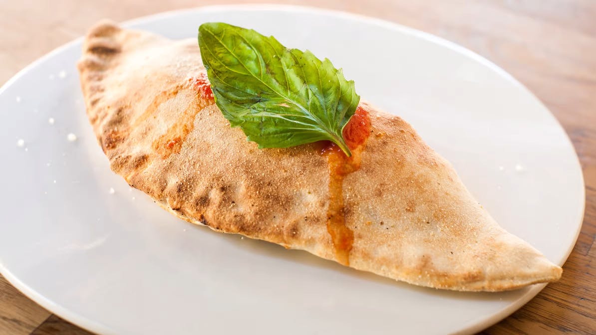 Order 4 Formaggi Calzone - Calzone food online from Broccolino Pizza store, Brooklyn on bringmethat.com