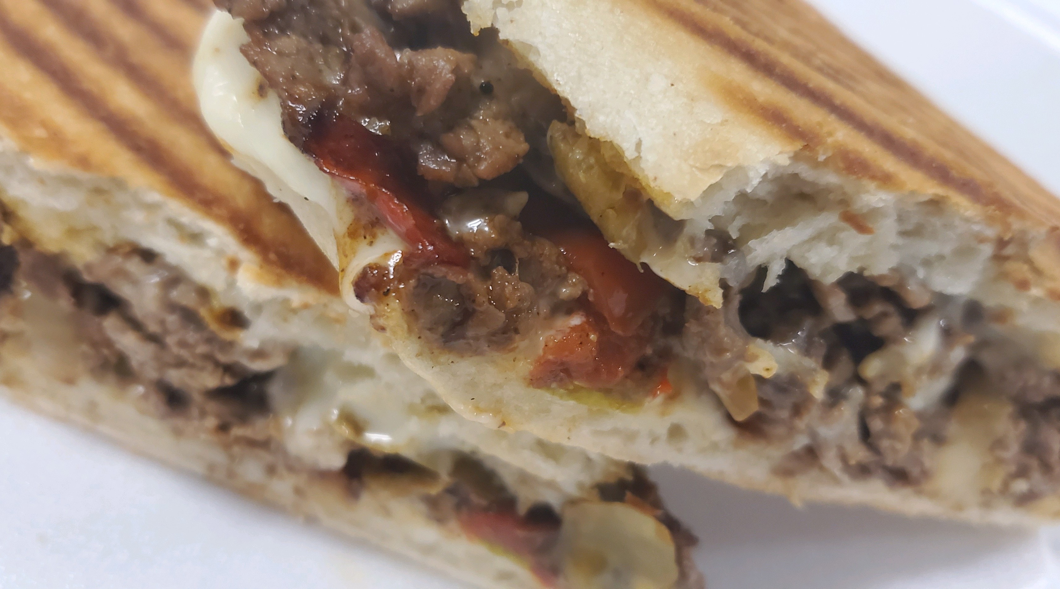 Order Cajun Steak and Cheese Panini food online from Knuckles Knockout Grill store, Rochester on bringmethat.com