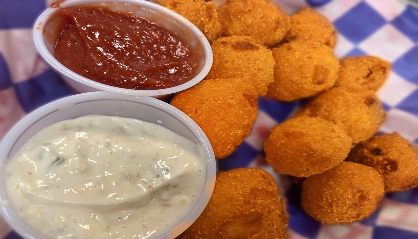 Order HushPuppies (Twelve Pieces) - 12 Pieces food online from Village Pizza & Seafood store, Texas City on bringmethat.com