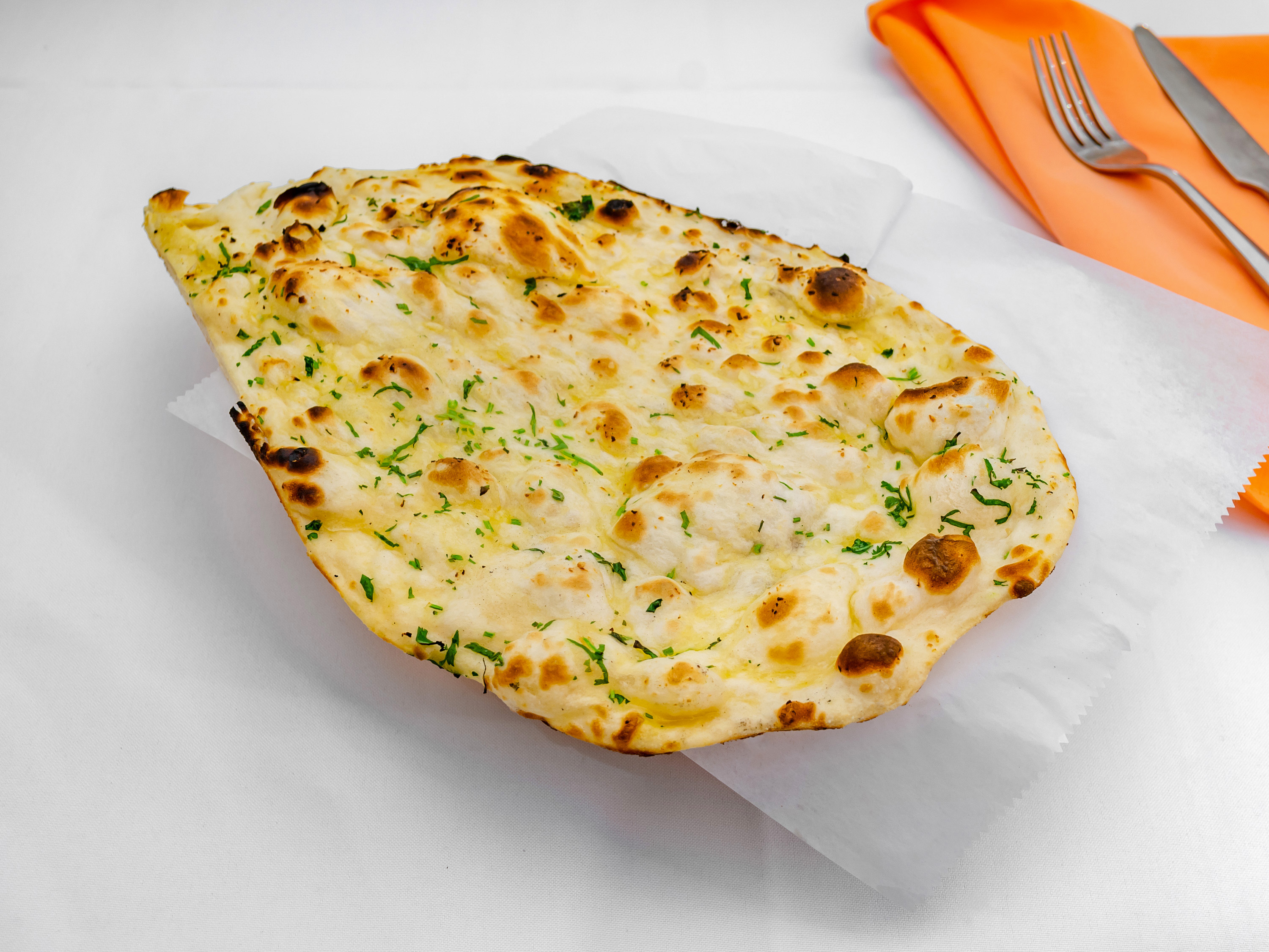 Order Garlic Naan food online from Maleen Banquet Hall and Restaurant store, Bellerose on bringmethat.com
