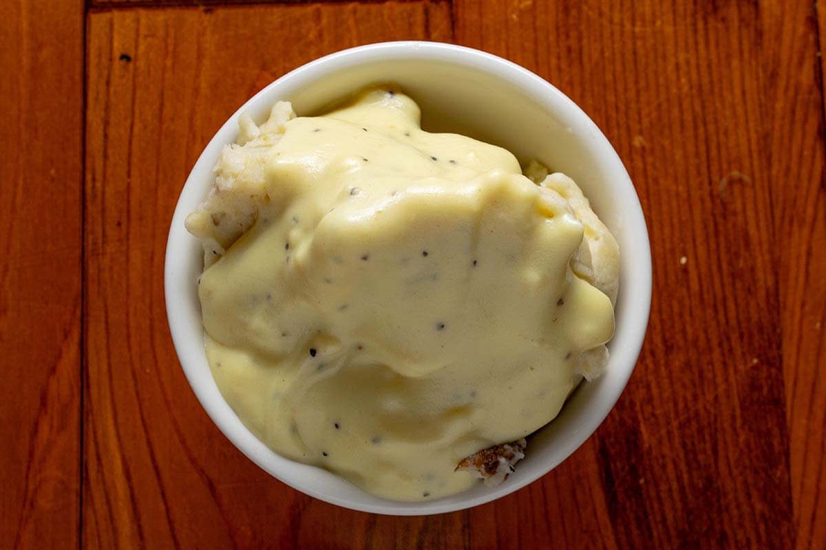 Order Mashed Potatoes food online from Boudreaux Cajun Kitchen store, Houston on bringmethat.com