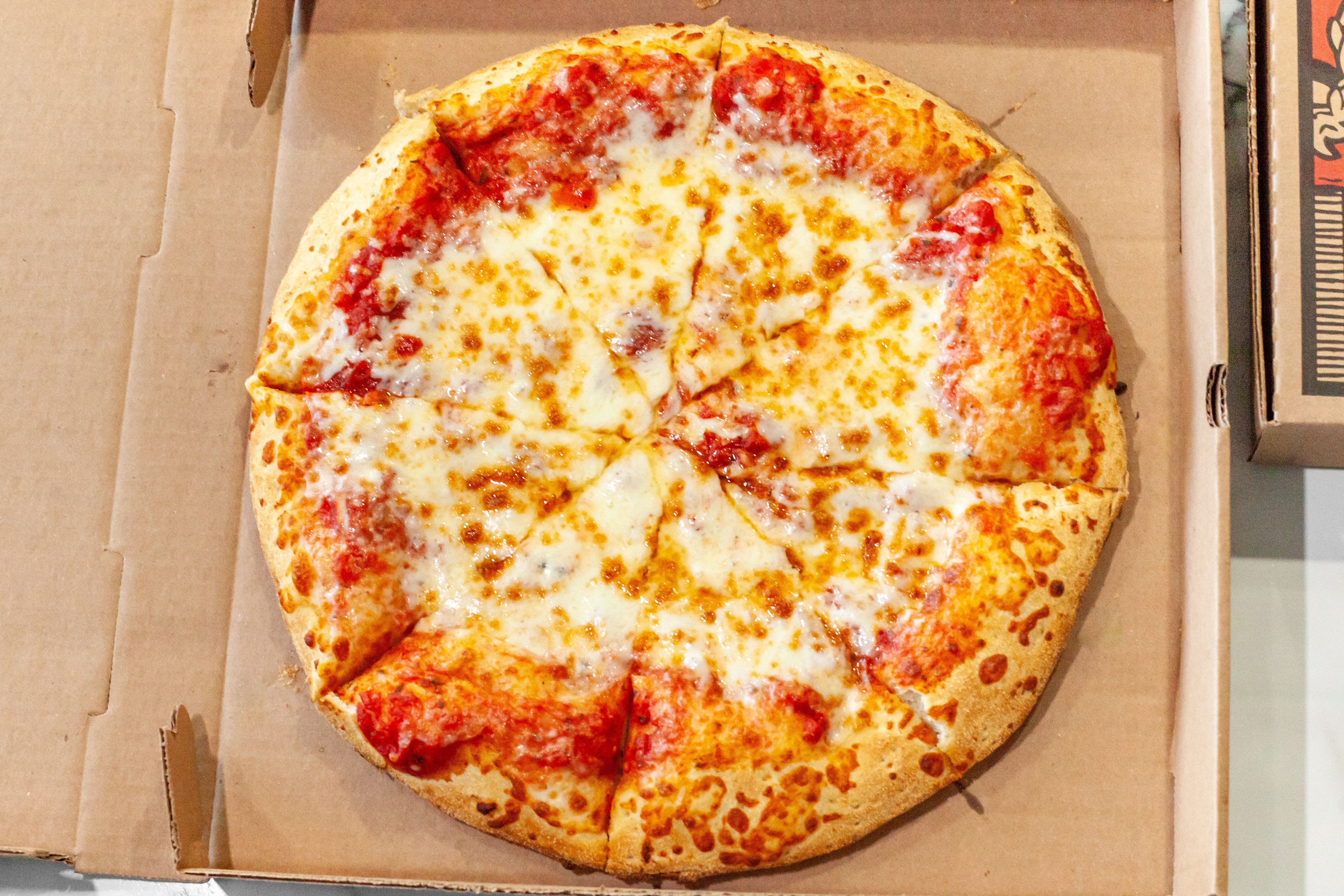 Order Plain Cheese Pizza - Personal 10'' food online from Mama's Pizza store, Fredericksburg on bringmethat.com