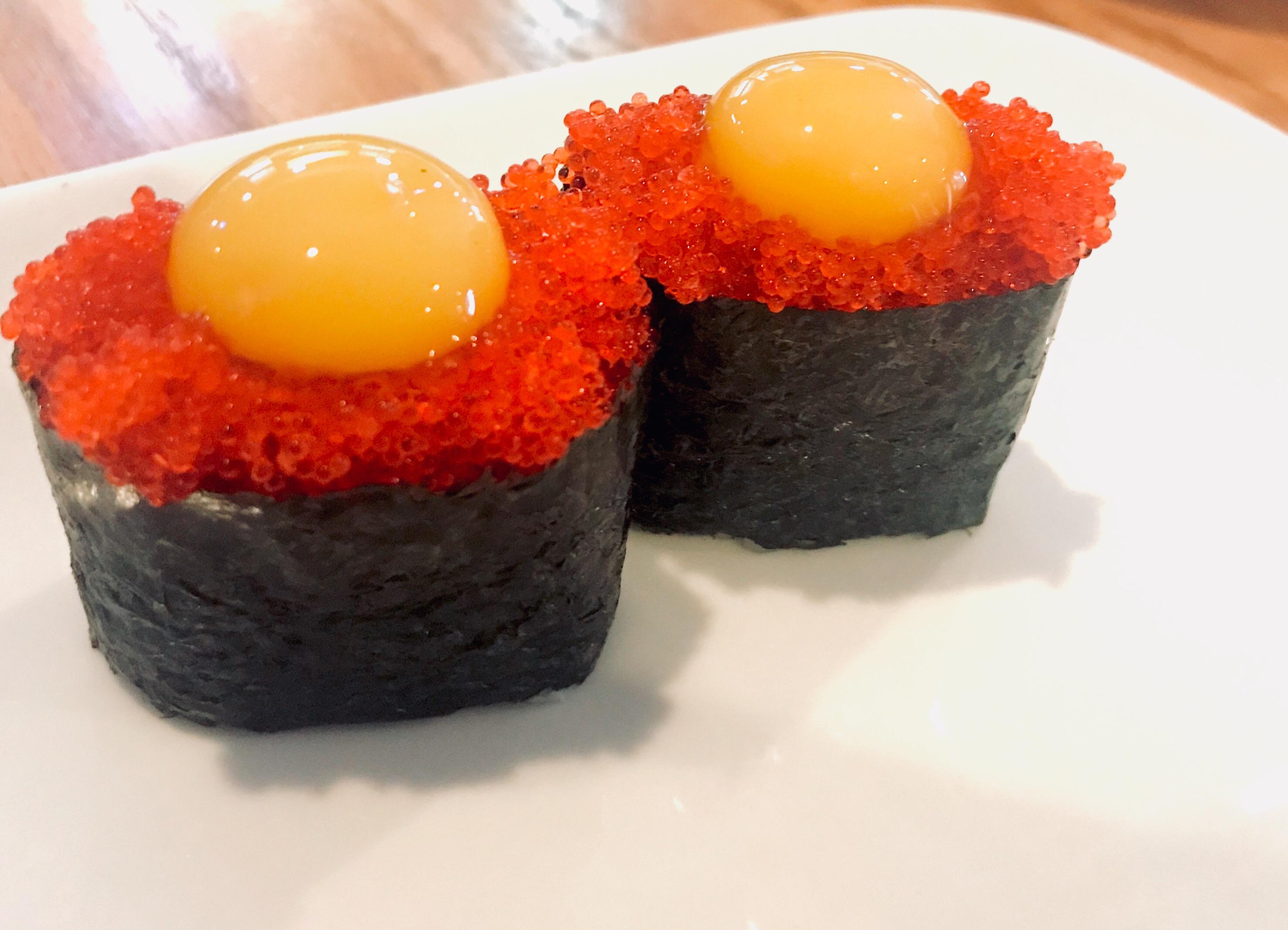 Order Tobi-Dama (Flying fish roe w/quail egg) Nigiri food online from Tgi Sushi store, San Jose on bringmethat.com