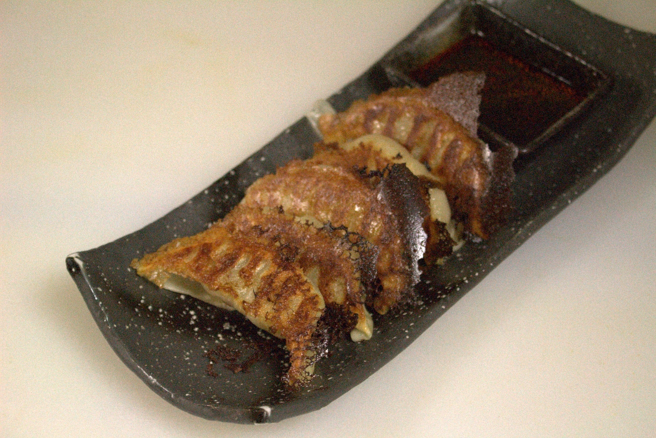 Order Pan fried Gyoza  (6pcs) food online from The Gokan by Musashi store, Seattle on bringmethat.com