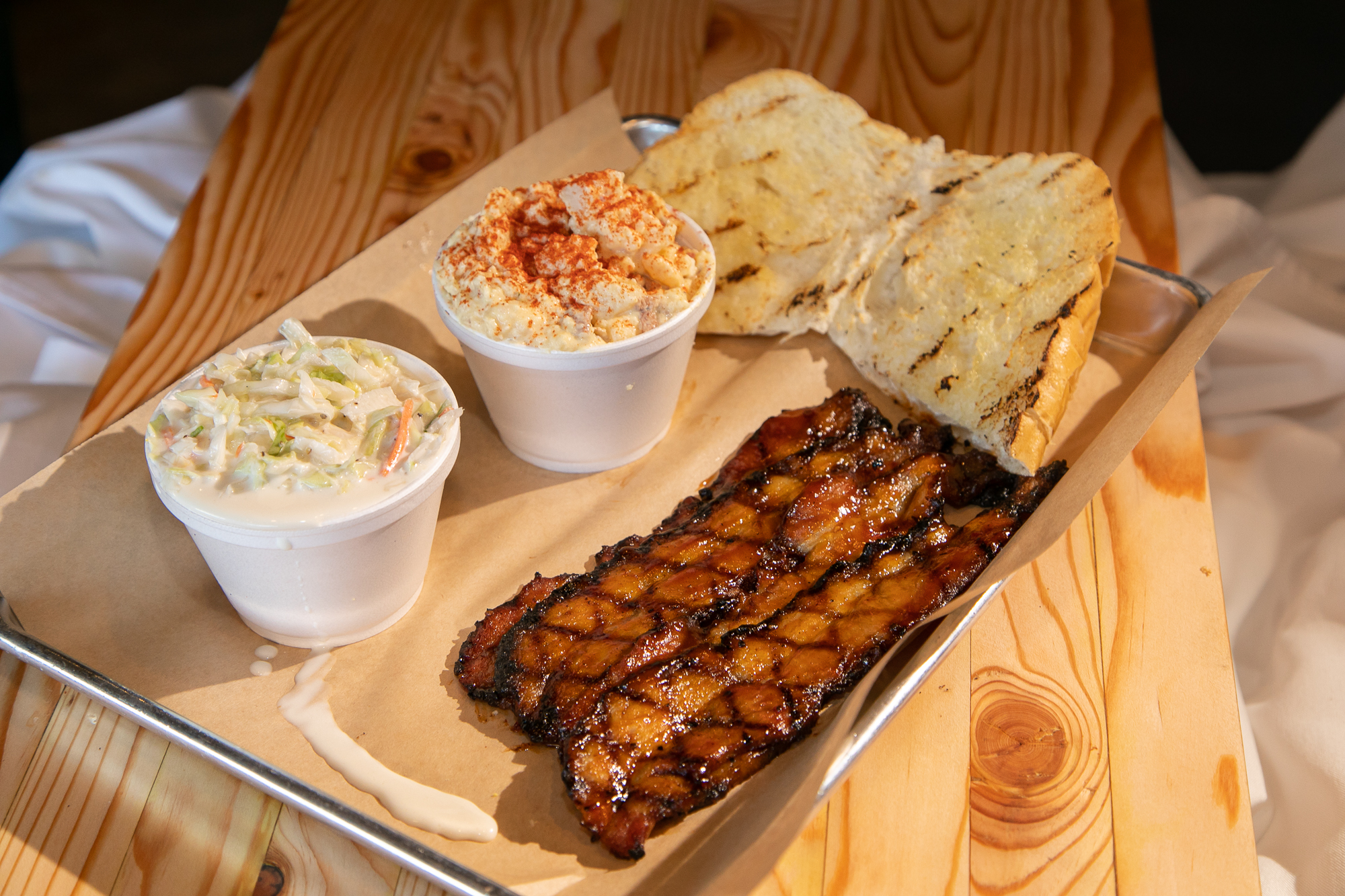 Order Grilled Pork Belly food online from Brushfire BBQ store, Tucson on bringmethat.com