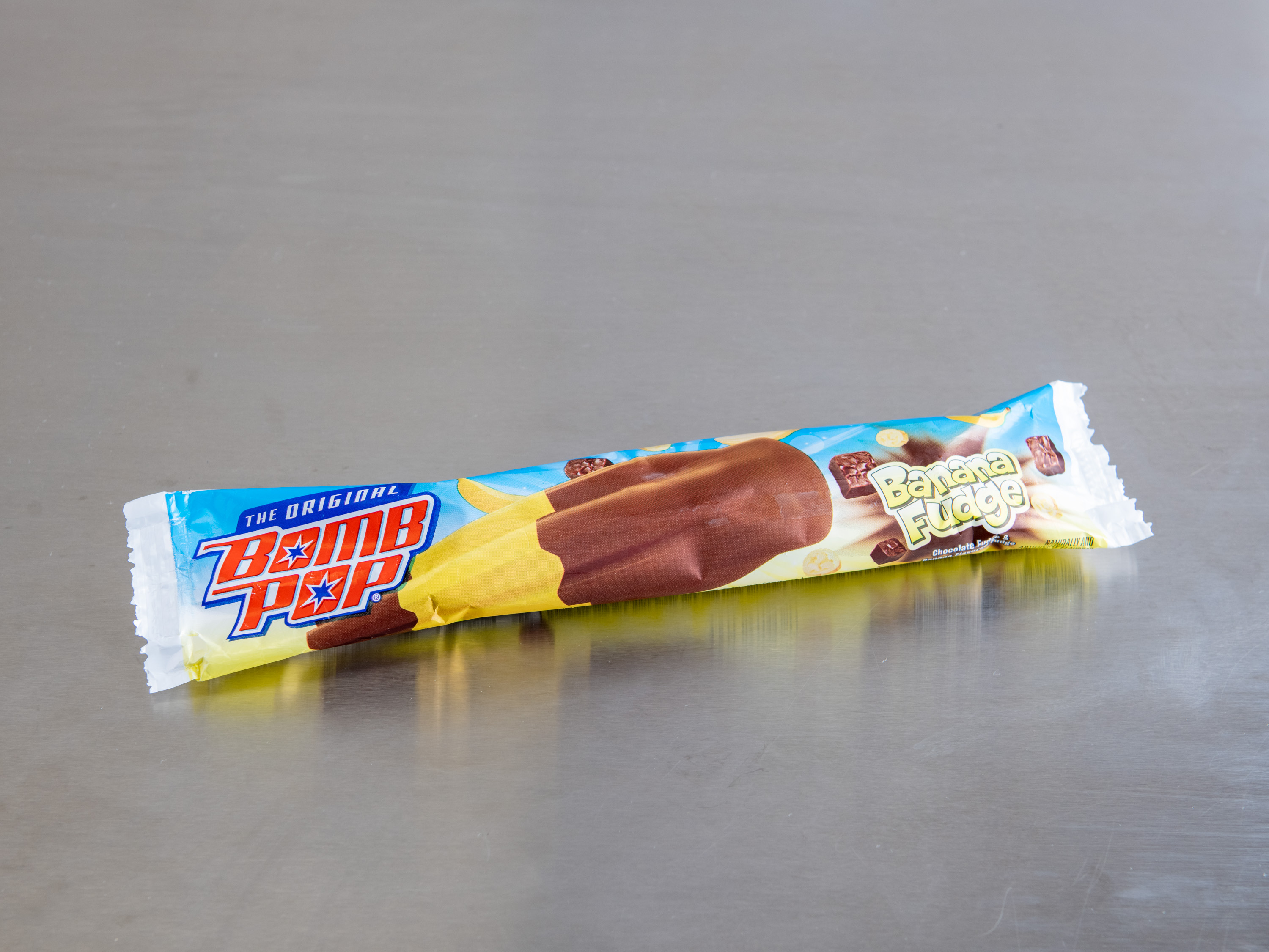 Order Banana Fudge Bomb Pop food online from Southern Ice Cream Corp store, Stafford on bringmethat.com