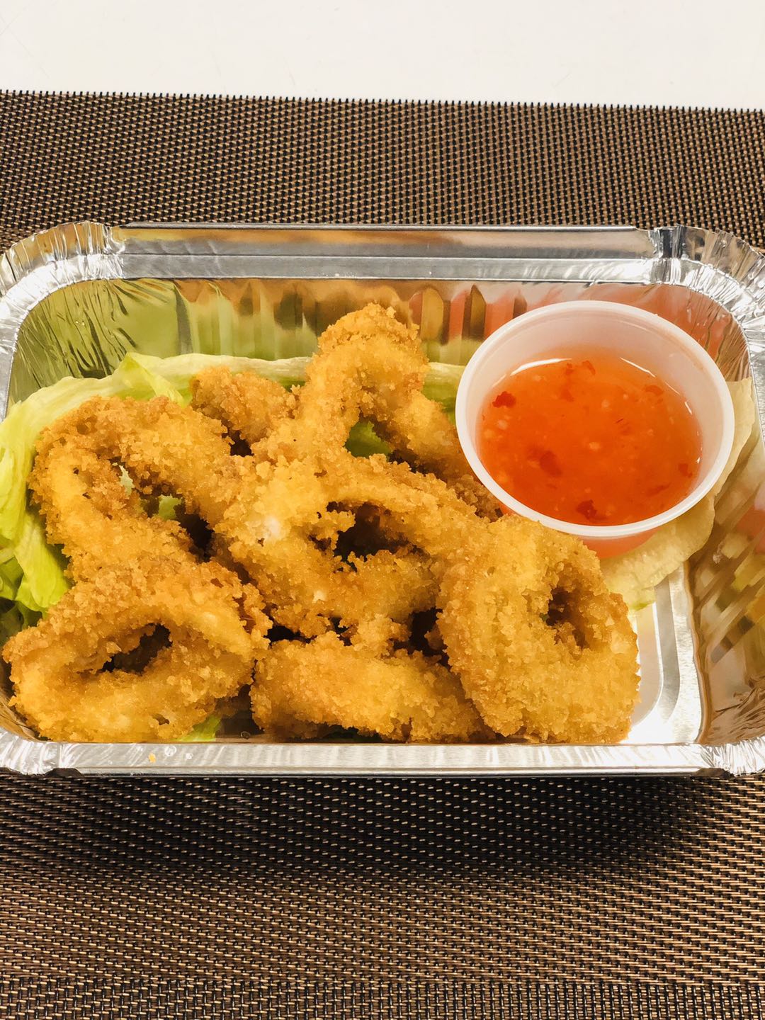 Order 16. Fried Calamari food online from Tomodachi Japanese Steakhouse & Sushi Bar store, Royersford on bringmethat.com