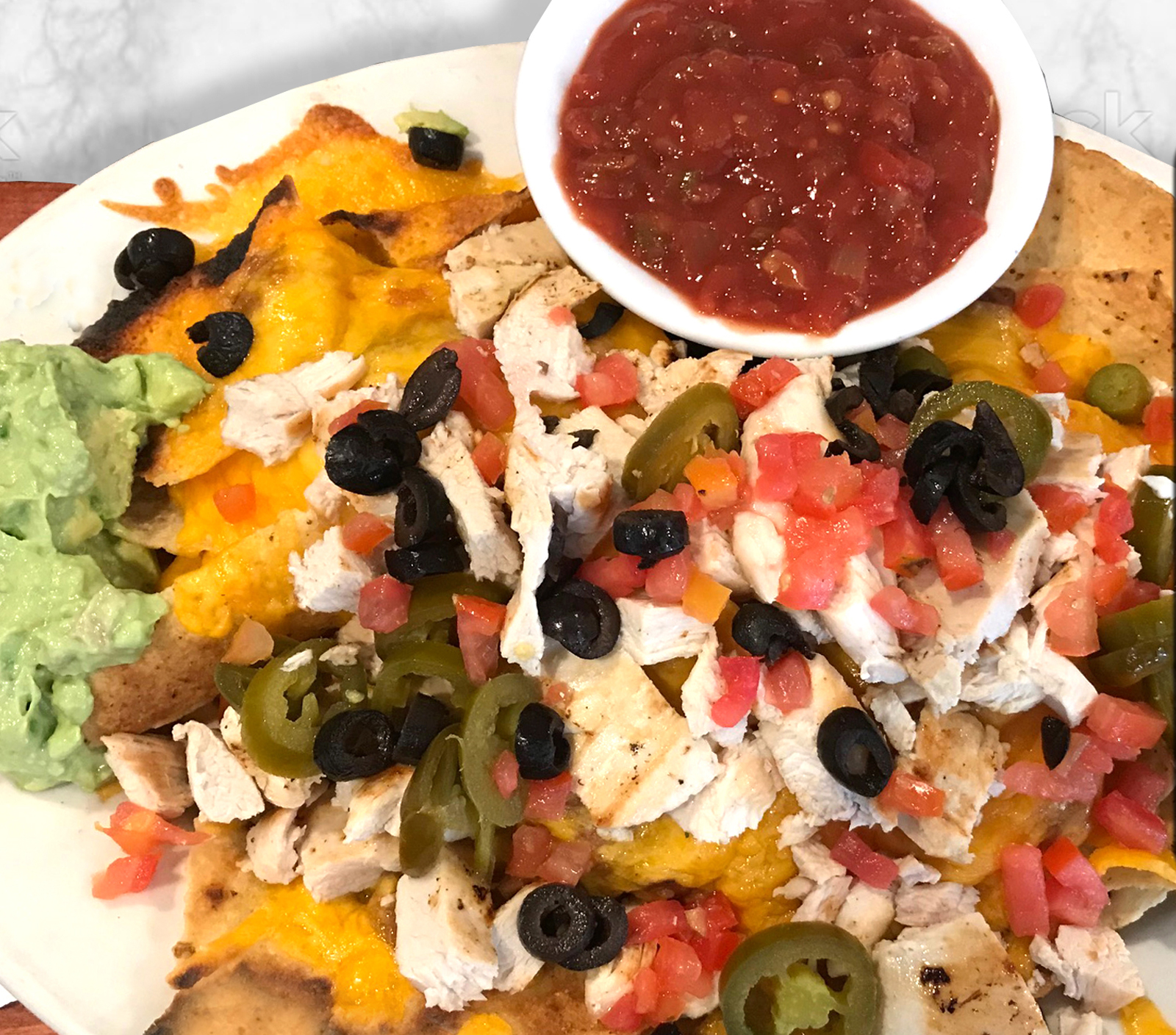 Order Nachos Deluxe food online from Pinocchio store, Palm Springs on bringmethat.com