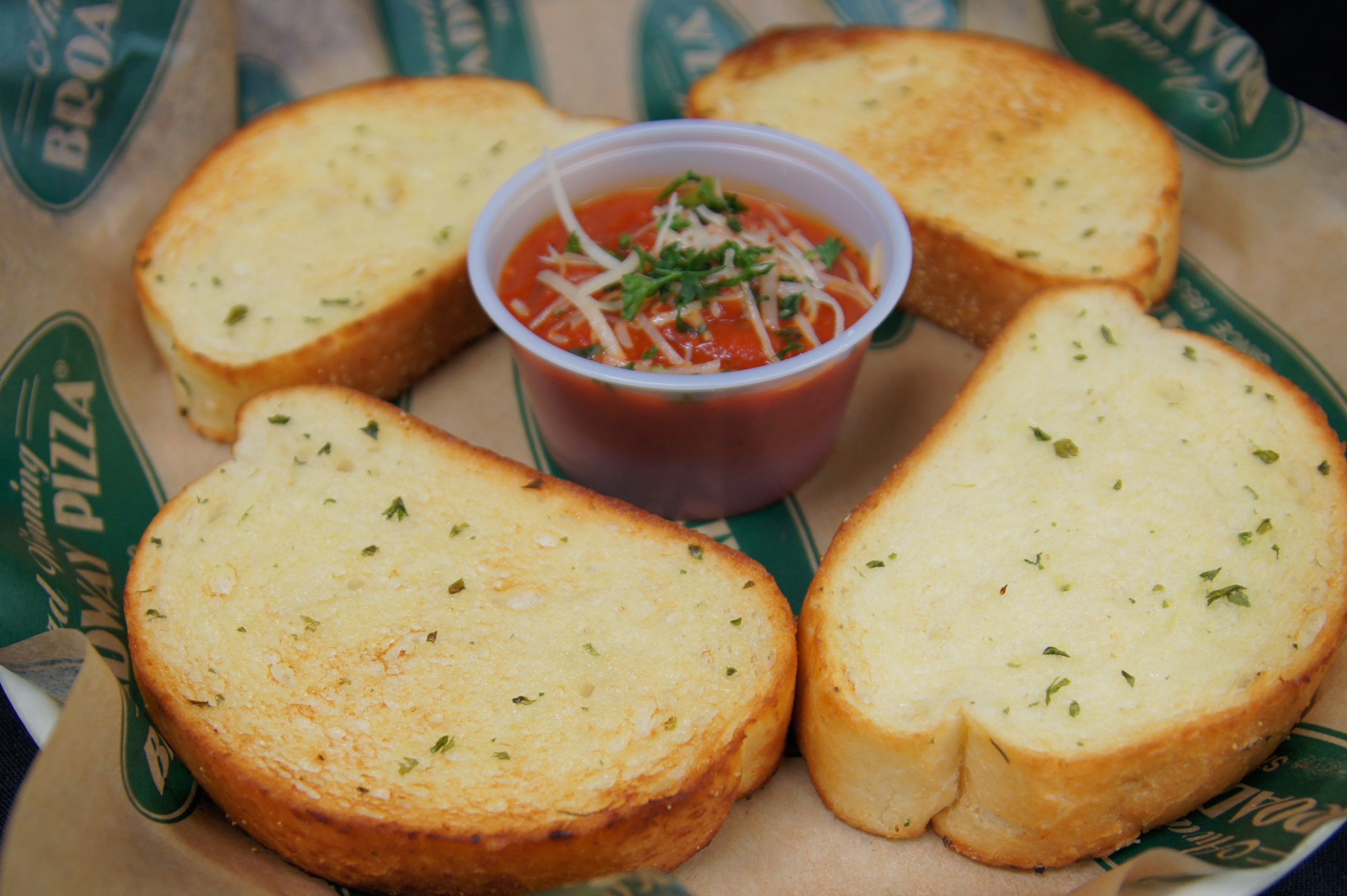 Order Garlic Toast (4 pieces) food online from Broadway Fast & Fresh store, Minneapolis on bringmethat.com