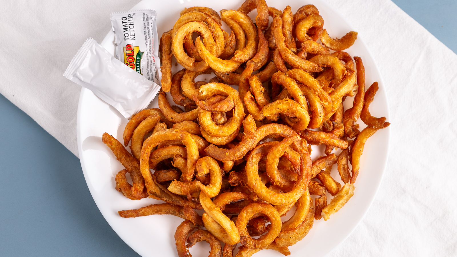 Order Curly Fries food online from Papa Saverios Pizzeria store, West Chicago on bringmethat.com