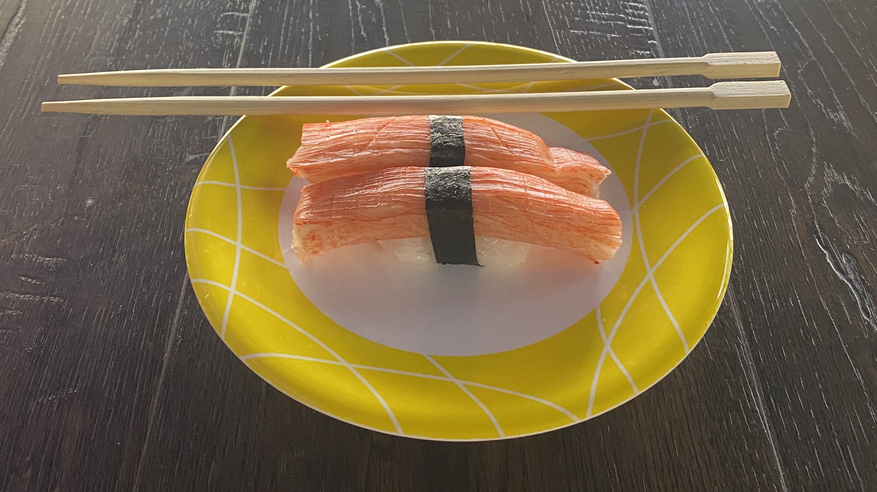 Order Crab Stick Nigiri - 2 Pieces food online from Sushi Train store, Minneapolis on bringmethat.com