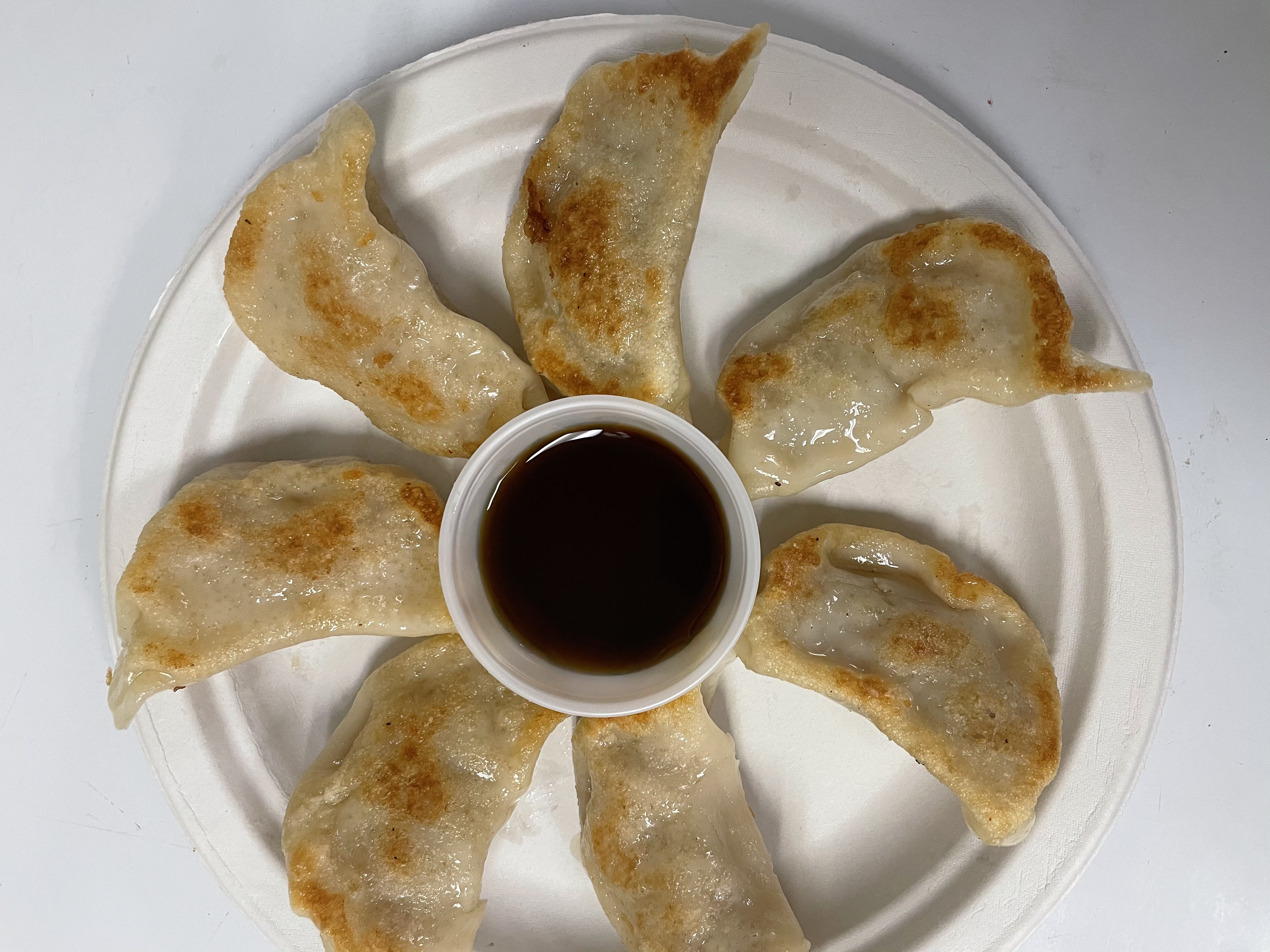 Order 7 Pieces Pot Stickers food online from Wa-Me Chinese Restaurant store, Orangevale on bringmethat.com