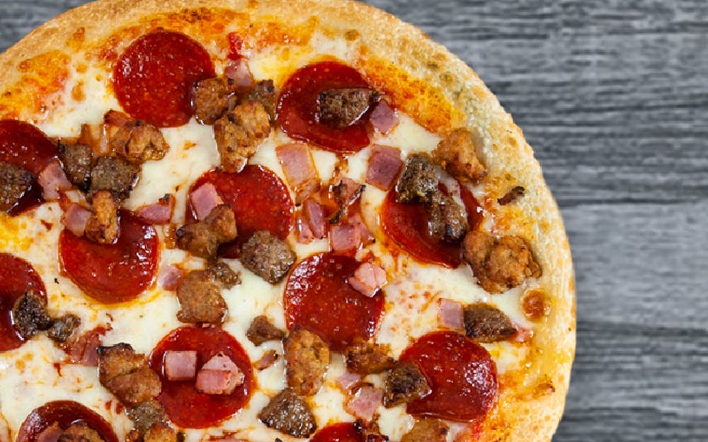 Order Quattro Meat Pizza - Medium food online from Seasons Pizza store, Wayne on bringmethat.com