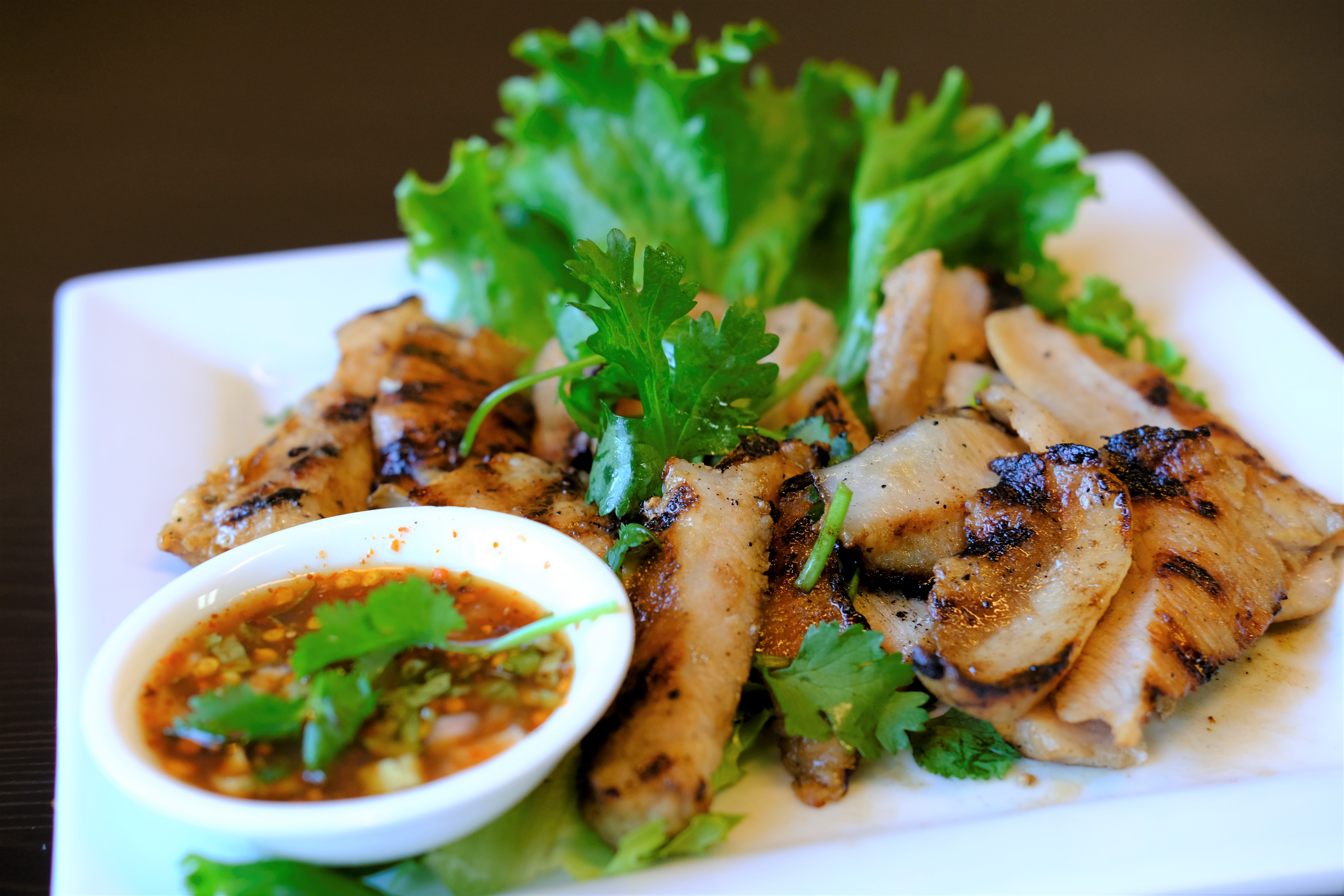 Order Kor Moo Yang food online from Thai Avenue store, Garden Grove on bringmethat.com
