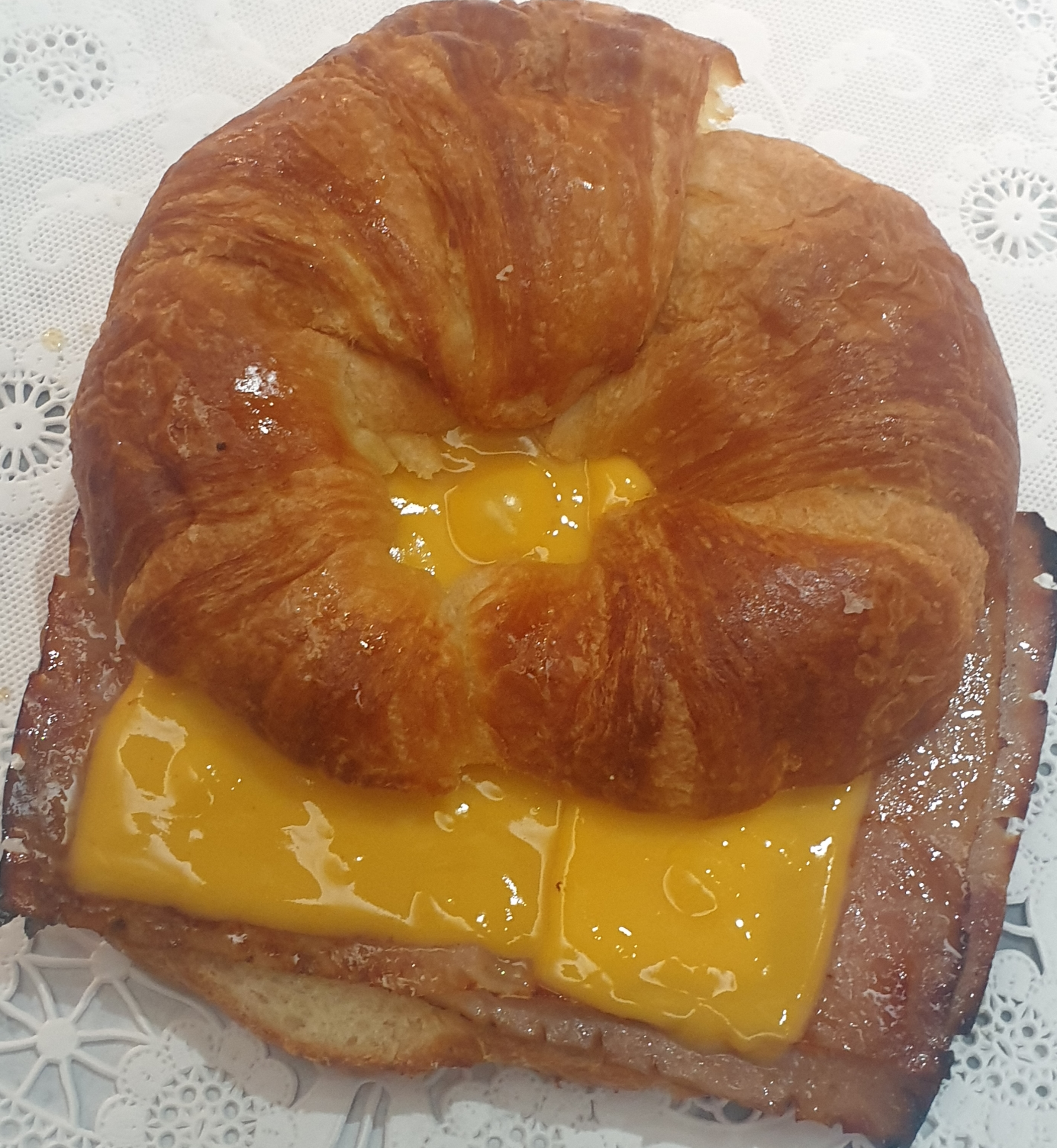 Order 11B-Ham Egg & Cheese on a Croissant food online from Taz Cafe store, New York on bringmethat.com