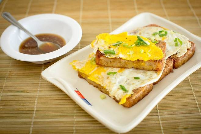 Order 40. Fried Daikon Cakes with Egg 蘿蔔糕加蛋 food online from Four Sea store, Hacienda Heights on bringmethat.com