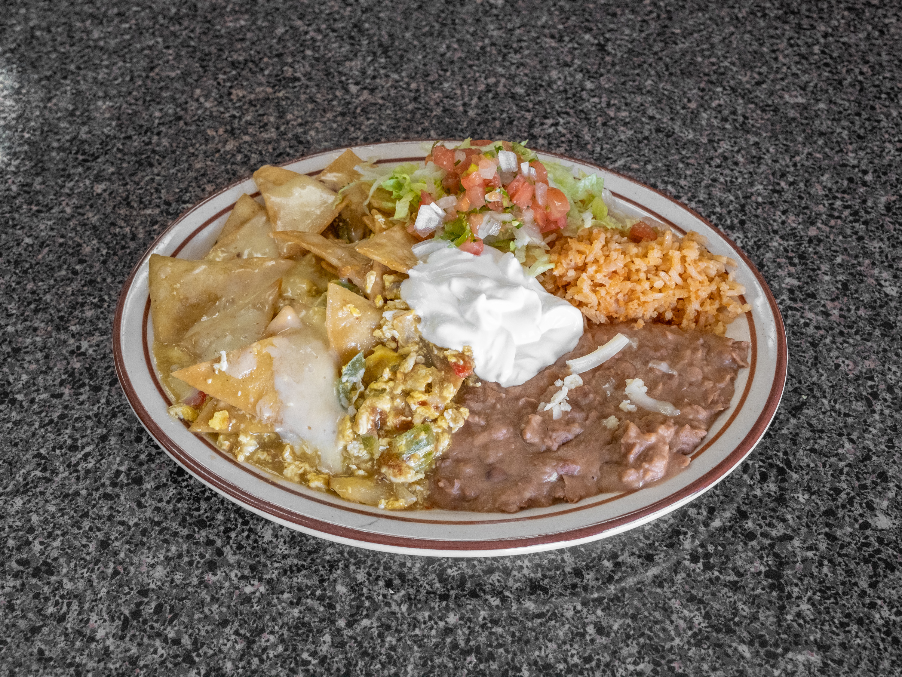 Order Chilaquiles Plan food online from Tacos Meche store, La Mirada on bringmethat.com