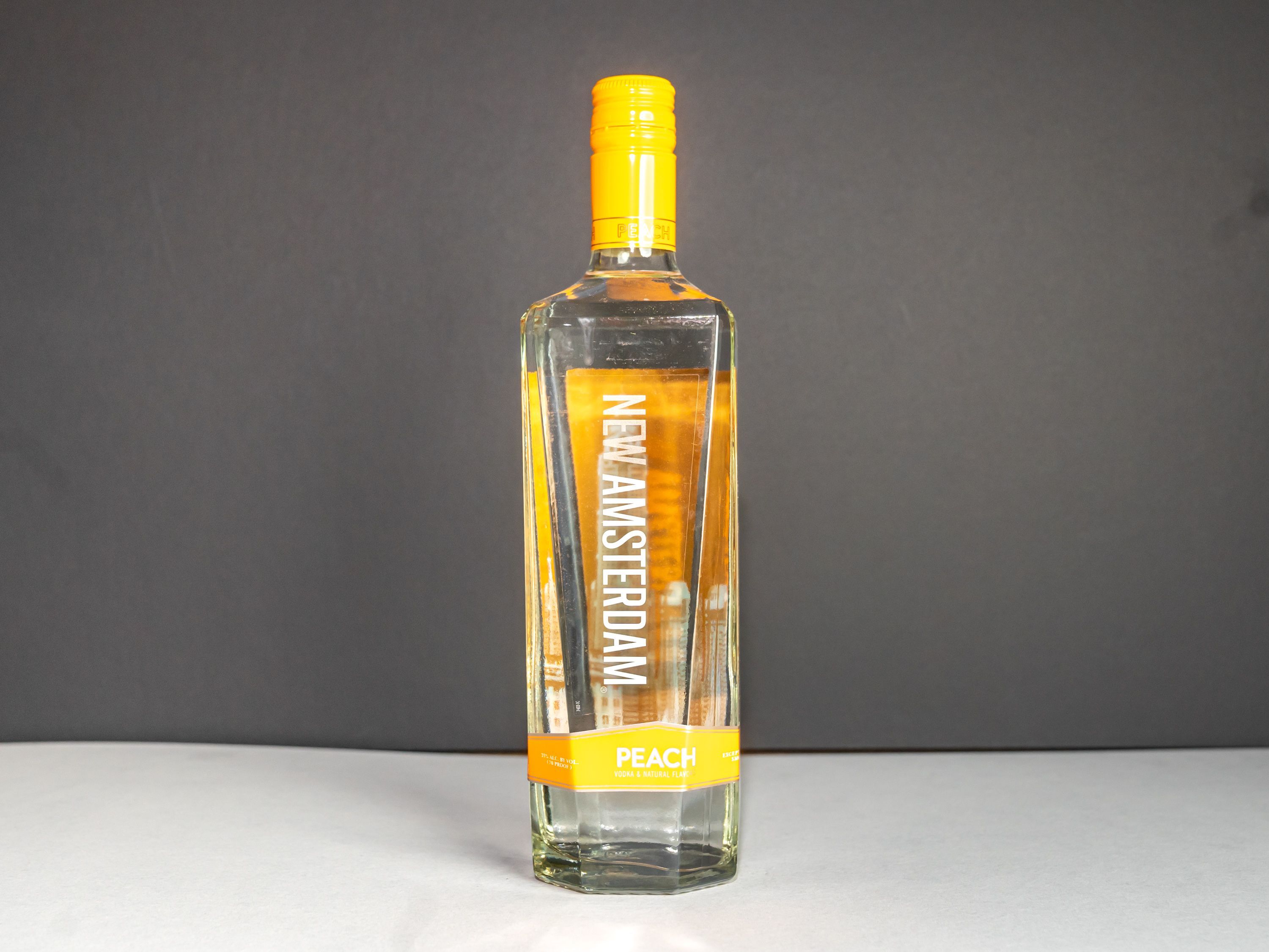Order New Amsterdam Peach Flavored, 750 ml Vodka food online from State Market store, San Francisco on bringmethat.com