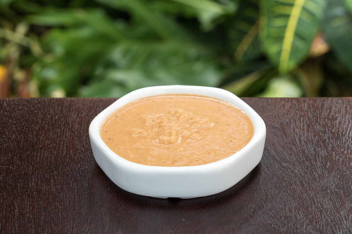 Order GINGER DRESSING 1oz food online from Ra Sushi store, Southlake on bringmethat.com