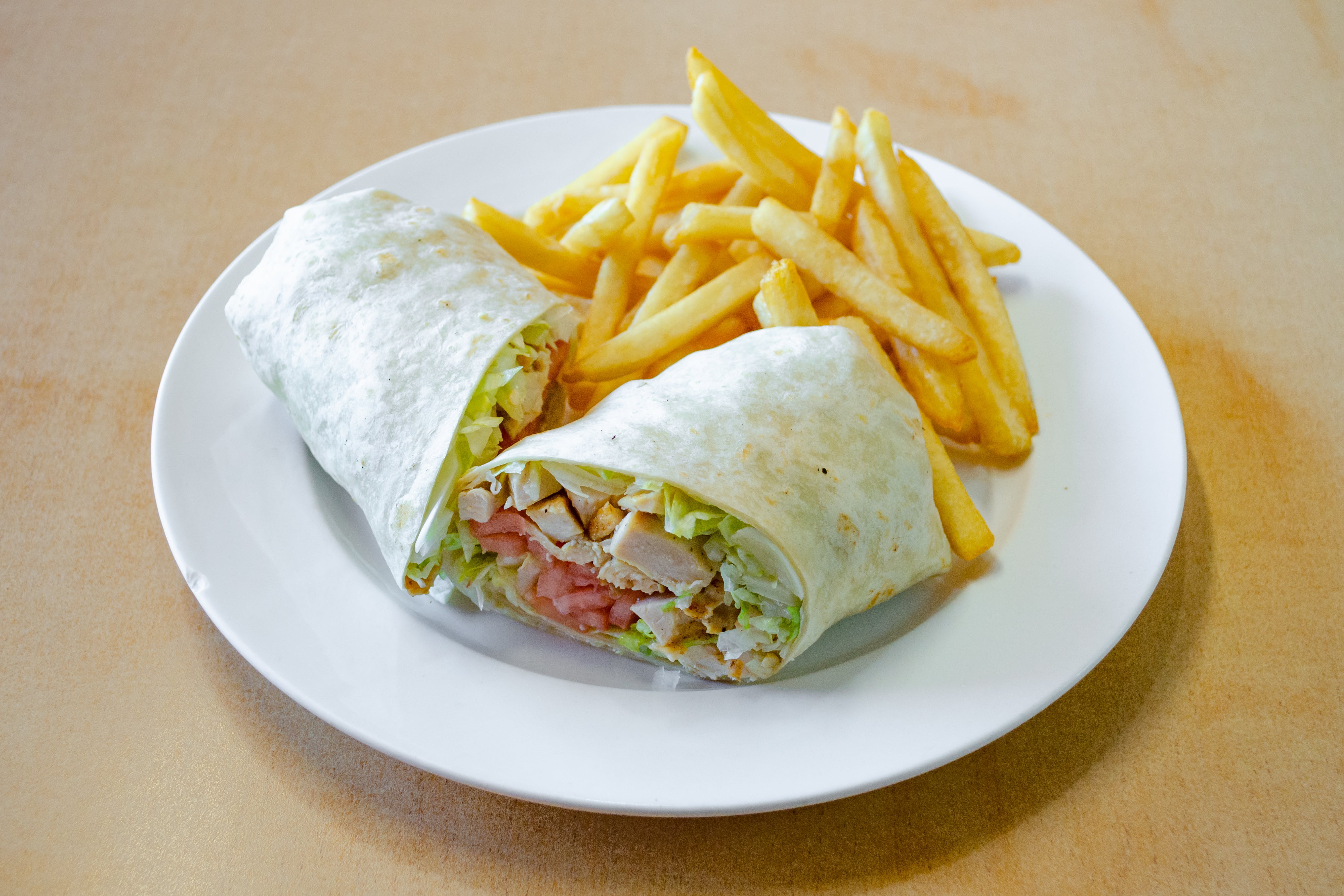 Order Grilled Chicken Wrap - Wrap food online from Ranchito Pizzeria & Mexican Restaurant store, Fords on bringmethat.com