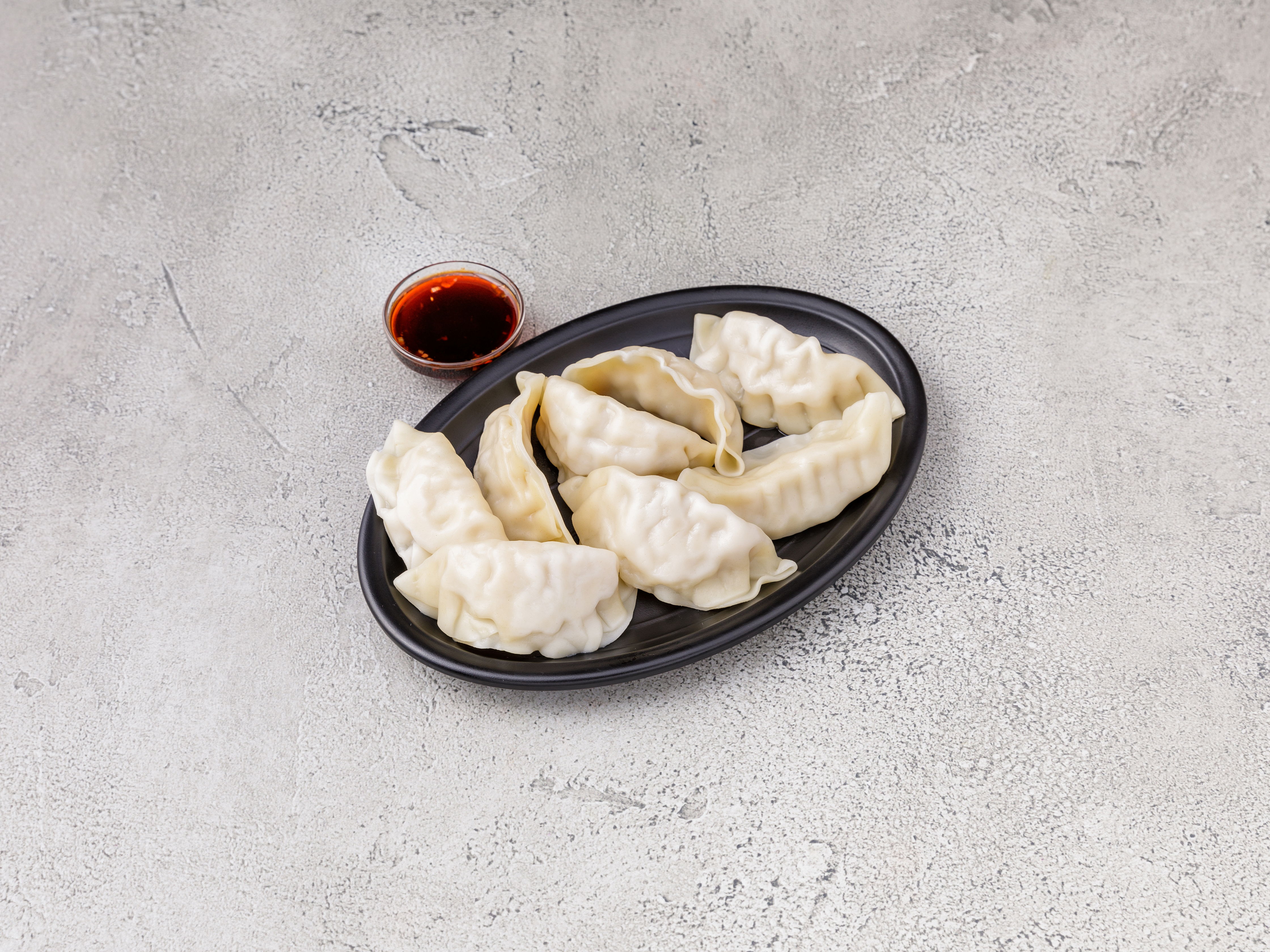 Order 9. Steamed Pork Dumplings food online from Bruce Lee Ii store, Halethorpe on bringmethat.com