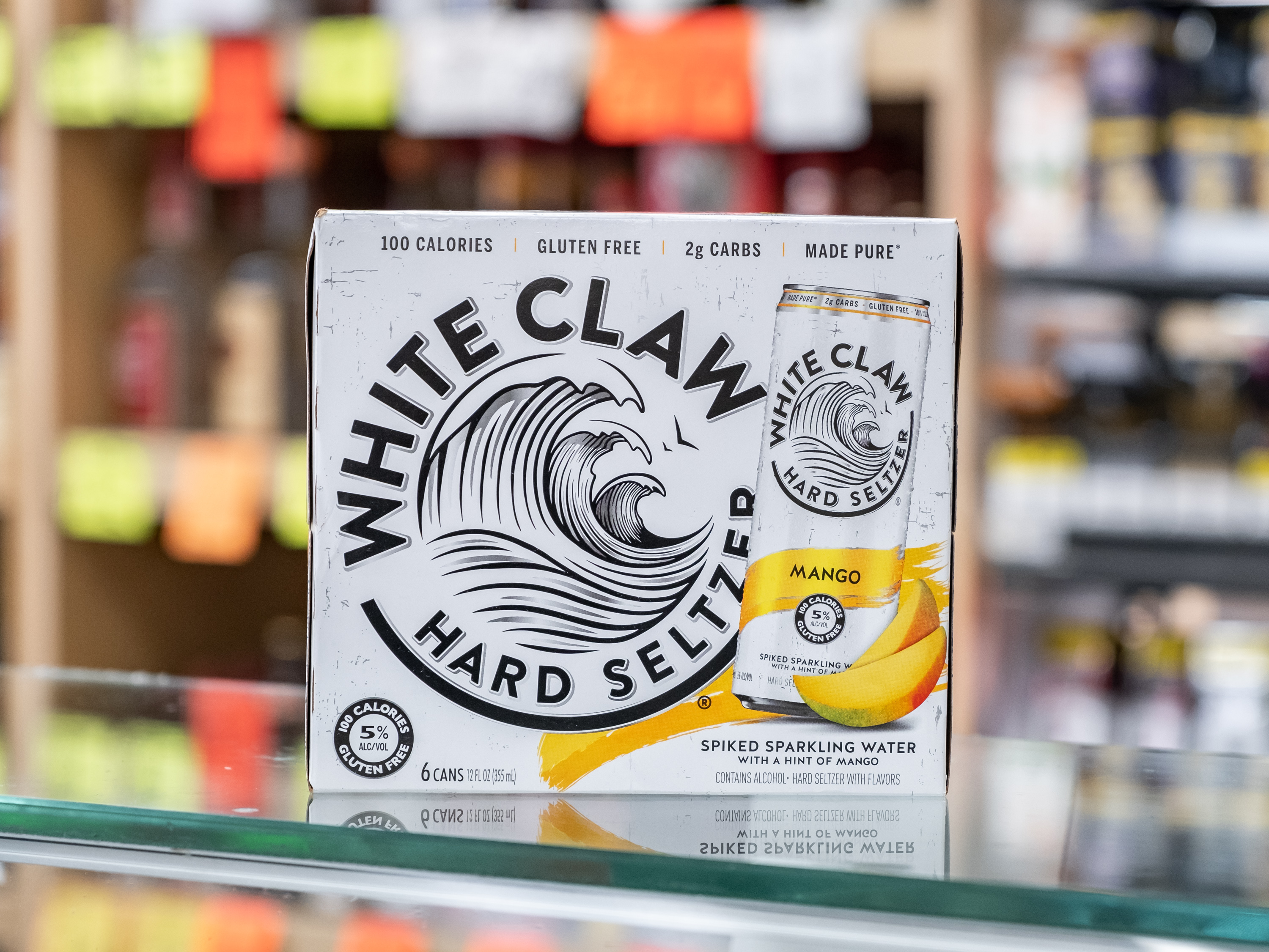 Order White Claw Mango Hard Seltzer food online from Circle S Food Store store, Orange on bringmethat.com
