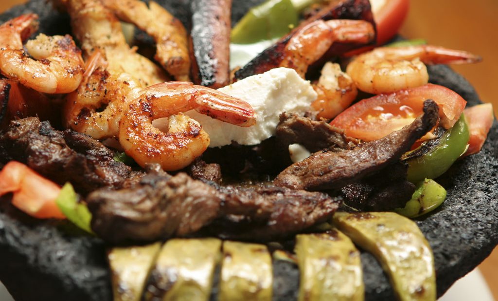 Order Molcajete food online from Toreros Mexican Restaurant store, Cary on bringmethat.com
