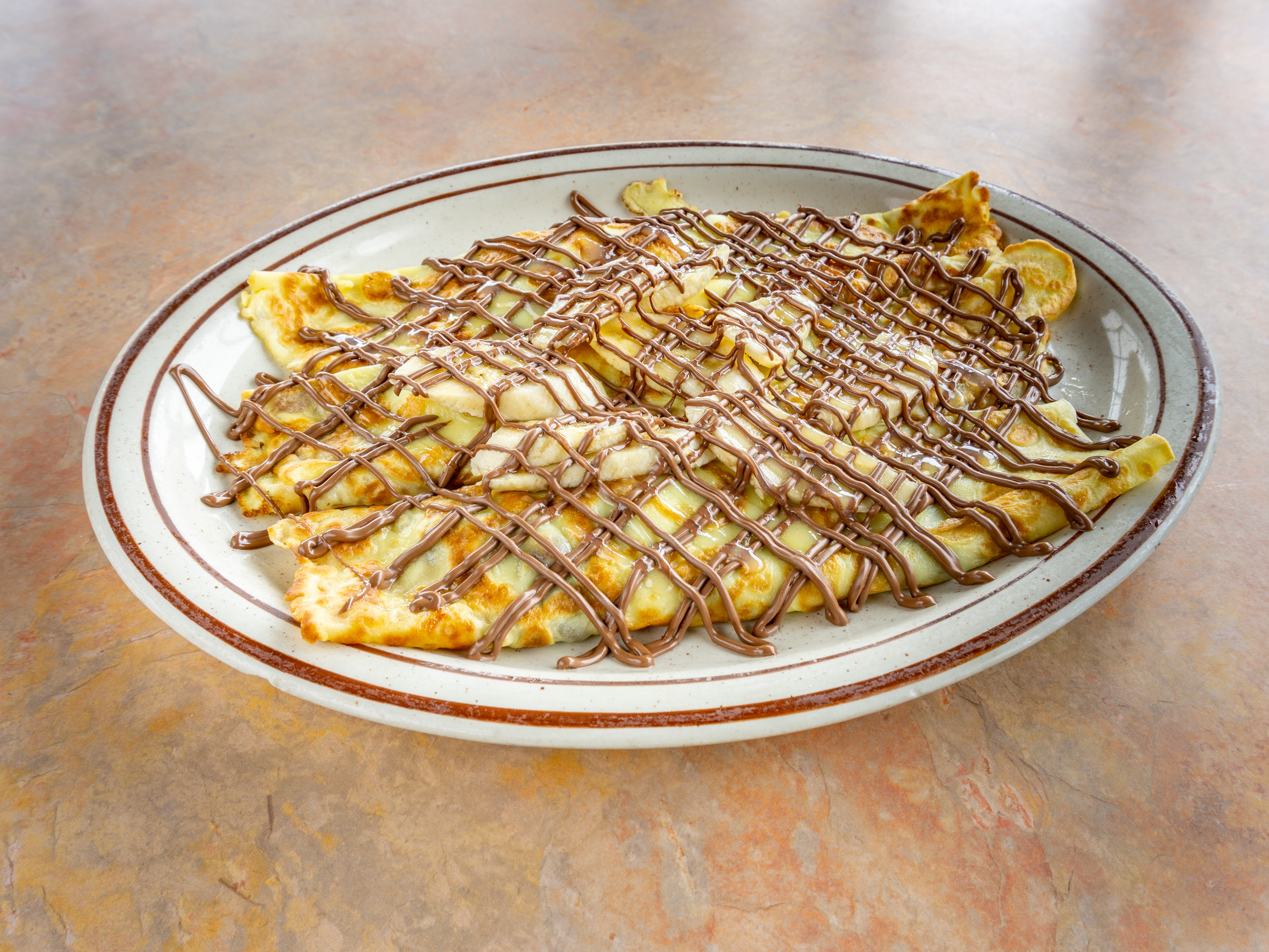 Order Nutella Banana Crepes  food online from Golden Bear Pancake & Crepery Restaurant store, Lansing on bringmethat.com