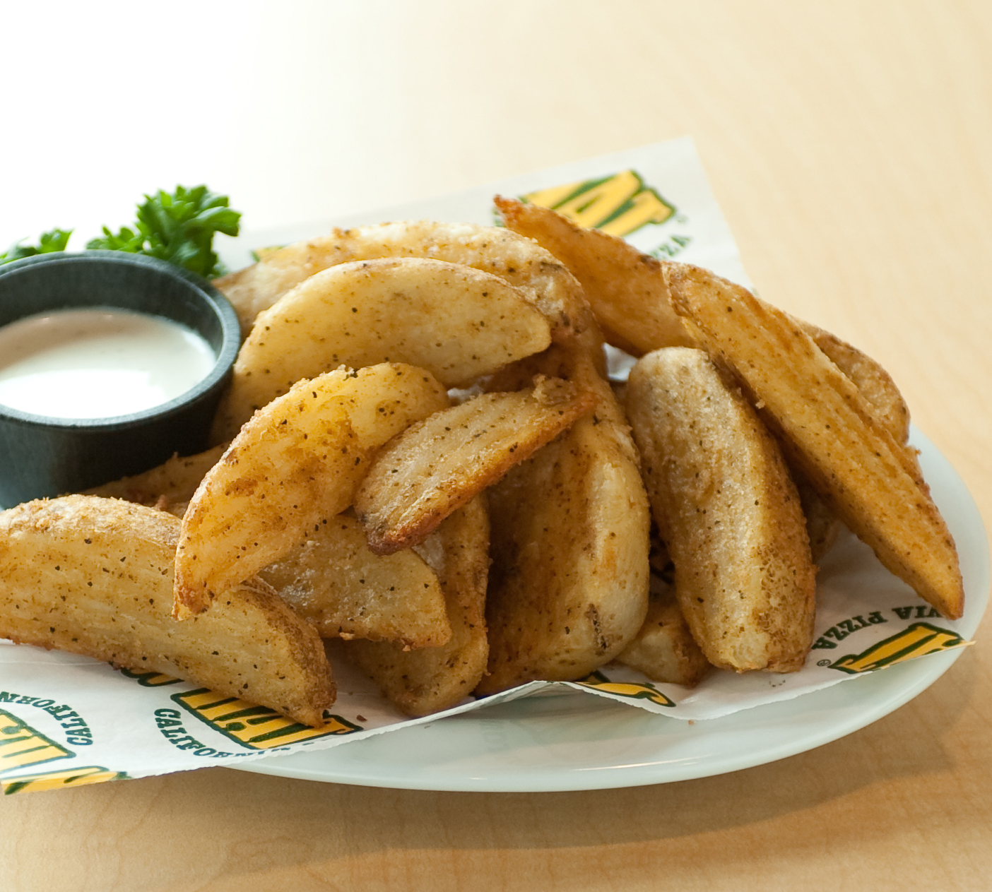 Order 1 lb. Potato Wedges food online from Straw Hat Pizza store, Gilroy on bringmethat.com