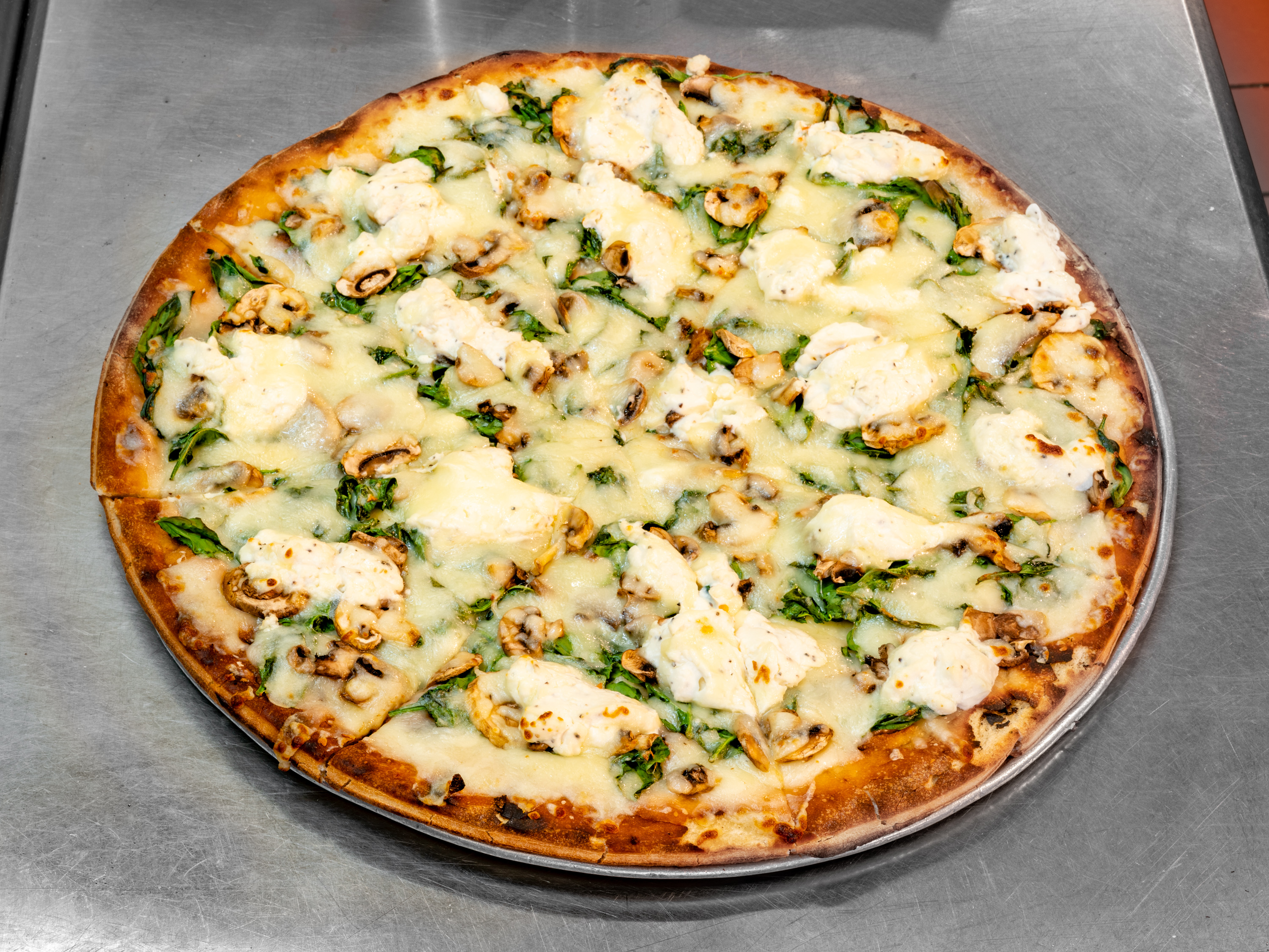 Order Stuffed Spinach Pizza food online from Tony's Pizza store, Whittier on bringmethat.com