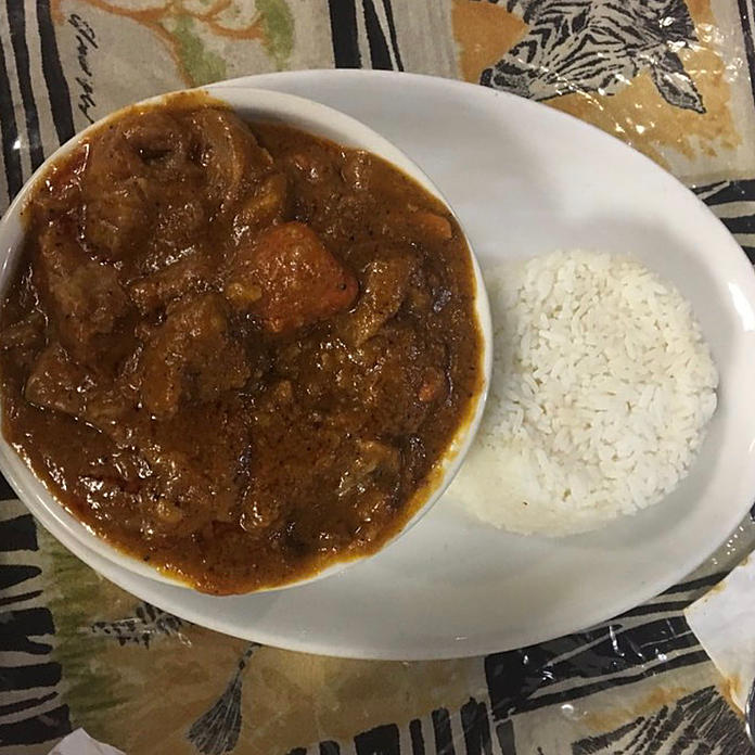 Order Thiou Curry with Lamb food online from Yassa African Restaurant store, Chicago on bringmethat.com