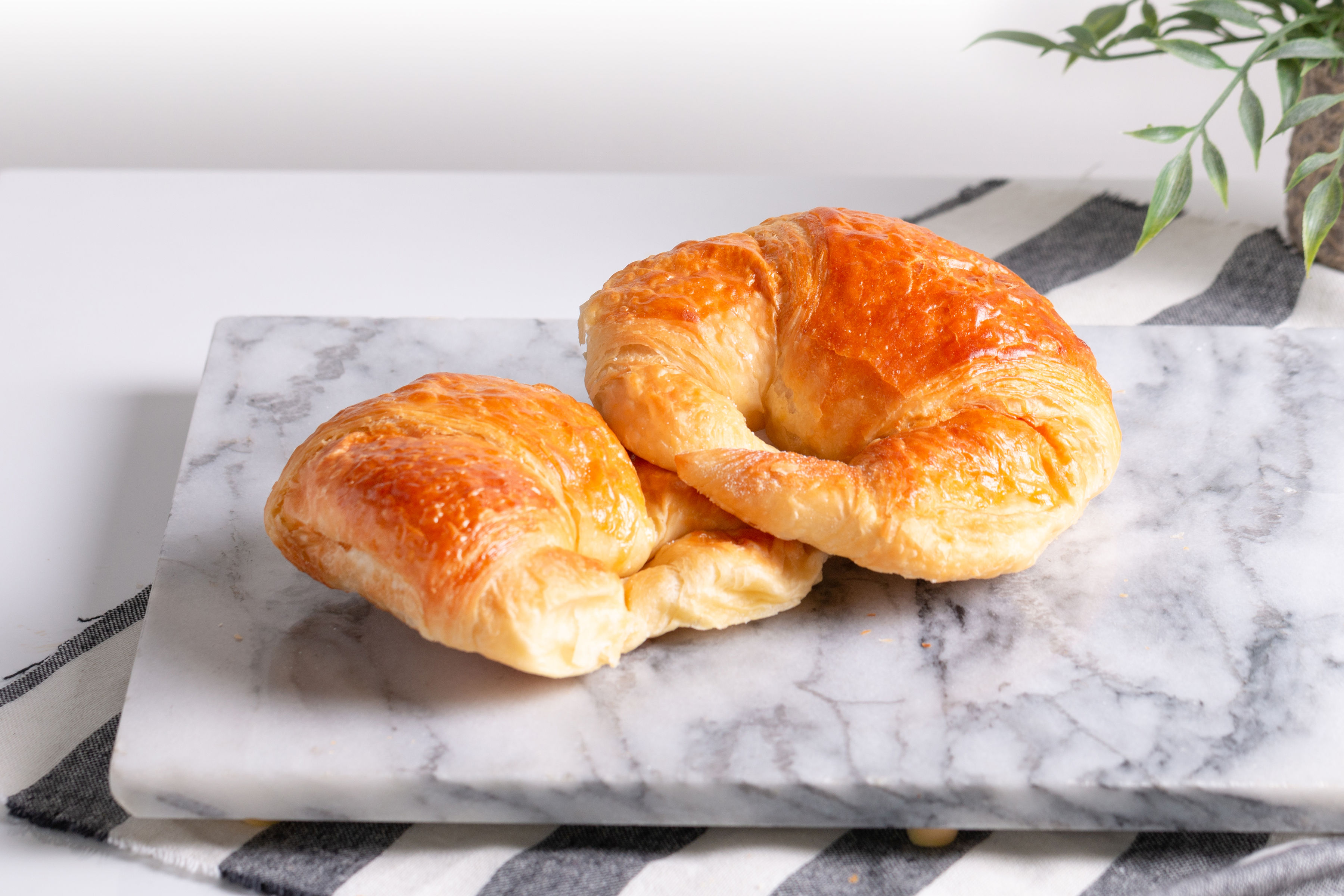 Order Butter Croissant food online from Java Bakery Cafe Lake Forest store, Lake Forest on bringmethat.com